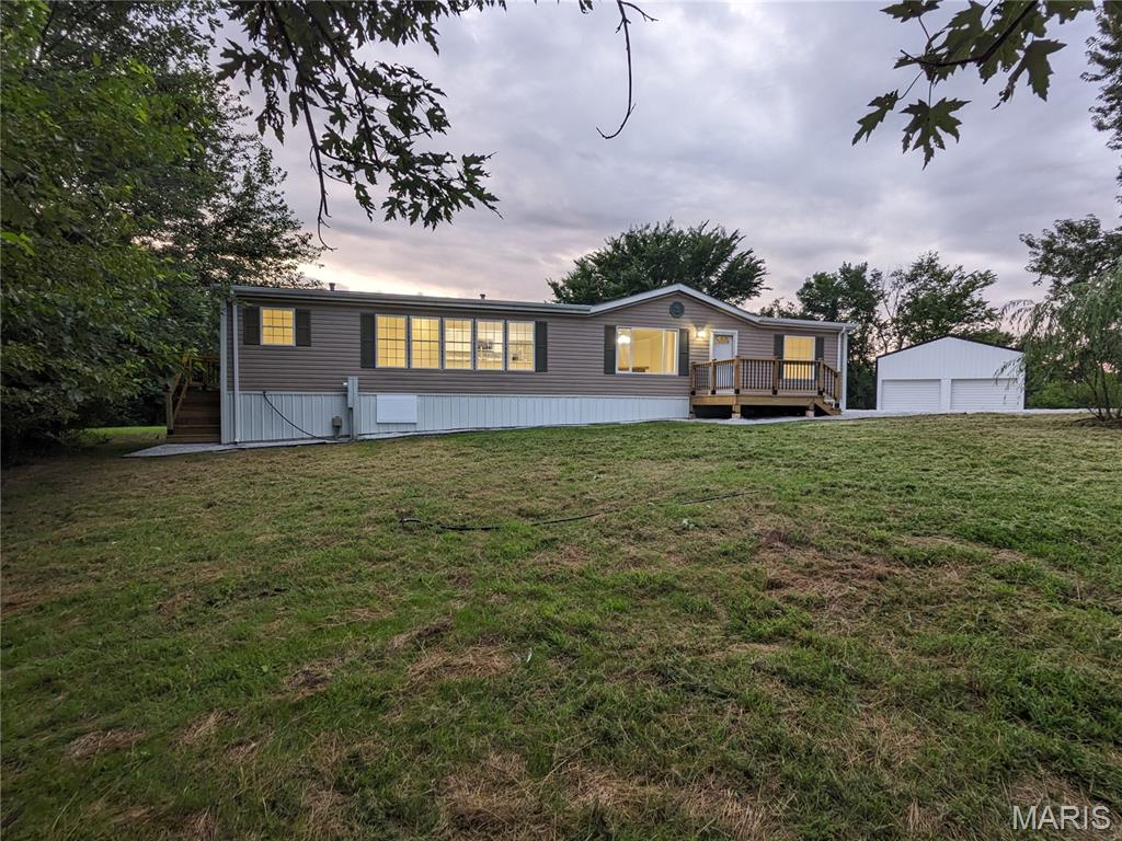 This is a 3-bedroom, 2-bathroom, move-in-ready home. It is located on a partially wooded 3-acre lot with mature shade trees, as well as a secluded, flat, open yard. This is a perfect opportunity for luxury homesteading with a 24' x 55' pole barn equipped with two horse stalls, a loft, and room to park up to three vehicles. Come step into the luxurious primary bathroom, experience the open living space, and enjoy the practical kitchen workstation. The back porch opens onto a yard designed for entertaining, complete with shade trees and a detached patio that is perfect for gathering around a fire pit in the fall. All appliances shown are included in the sale of this property. A brand-new AC system was installed in the spring of 2026. Make this the perfect horse property by adding one or more of the additional 3-acre lots in this four-lot development, for a total of up to 12 acres.