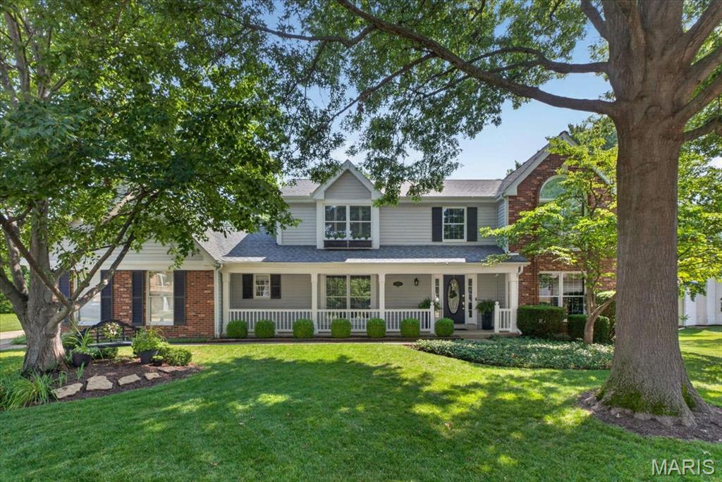 Welcome to this beautifully updated 2-story home tucked away on a quiet cul-de-sac in the highly desirable Coventry Farm subdivision of Chesterfield. Offering 4 bedrooms, 3 full baths, 1 half bath, and over 3,800 square feet of finished living space, this exceptional home blends timeless elegance with modern updates in the award-winning Rockwood School District. From the moment you arrive, you'll be impressed by the charming curb appeal, mature shade trees, professionally landscaped yard, and inviting covered front porch. Step inside to a grand two-story foyer featuring gleaming hardwood floors, elegant crown molding, and an open staircase that sets the tone for the rest of the home. Designed for both everyday living and entertaining with gorgeous custom plantation shutters throughout. The spacious formal dining room provides the perfect setting for holiday gatherings, while the private front office is light and bright creates an ideal work-from-home space. The expansive family room is filled with natural light from oversized windows and is anchored by a beautiful fireplace with flanking cabinets, creating a warm and inviting atmosphere. The heart of the home is the stunning, featuring fully renovated kitchen, custom cabinetry, paneled appliances, oversized farmhouse sink, interior upgraded pullouts and quartz countertops. A large center island with seating, breakfast bar, stainless steel stove, custom paneled beverage refrigerator, updated designer lighting, pantry, and abundant cabinet and prep space. The adjoining breakfast room overlooks the private backyard and offers seamless access to the outdoor living area. Upstairs, the luxurious primary suite serves as a peaceful retreat with vaulted ceilings, hardwood flooring, a spacious walk-in closet, and a spa-inspired ensuite bath showcasing dual vanities, custom cabinetry, an air jetted tub, oversized walk-in shower with designer tile, and elegant finishes throughout. Three additional generously sized bedrooms and an updated full bathroom provide plenty of space for family and guests. The finished walk-up lower level with new luxury vinyl plank flooring, offers endless flexibility with a large recreation room featuring extensive custom built-in cabinetry, a spacious family room, dedicated fitness area, additional sleeping area or guest room, full bathroom, and ample storage. Step outside to enjoy the beautifully landscaped, level backyard complete with a spacious patio, mature trees, and plenty of room for outdoor entertaining, gardening, or simply relaxing in your own private oasis. Additional highlights include a main-floor laundry room with custom cabinetry, hardwood flooring throughout the main level and all but 2 bedroom upstairs, recessed lighting, updated bathrooms, a two-car oversized rear entry garage, zoned HVAC and exceptional storage throughout the home. Conveniently located near shopping, dining, parks, walking trails, and major highways, this move-in-ready Chesterfield home offers the perfect combination of luxury, comfort, and an unbeatable location. Don't miss your opportunity to make this Coventry Farm gem your next home!