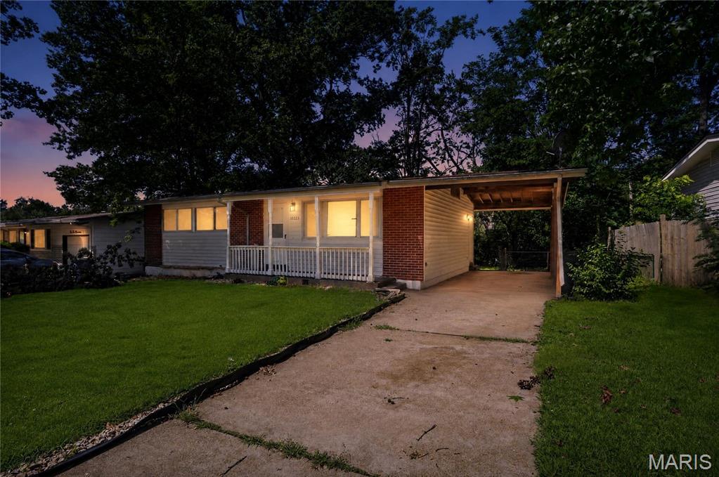 Welcome to 10223 Reba Dr, a charming single-story ranch home located in the heart of St. Louis County. Featuring 3 comfortable bedrooms and 1 bathroom across 1,014 square feet of intelligent living space, this residence pairs classic architectural bones with real functional value.  The main level boasts an inviting flow with fresh carpeting and clean 6-panel doors throughout. A standout highlight of this property is the newly finished lower level, offering a versatile bonus area perfect for a family room, home office, or hobby space.  Outside, the level lot features a convenient carport and plenty of room for outdoor activities. Situated in a quiet, established neighborhood, you're just minutes from local schools, parks, and major transit routes.