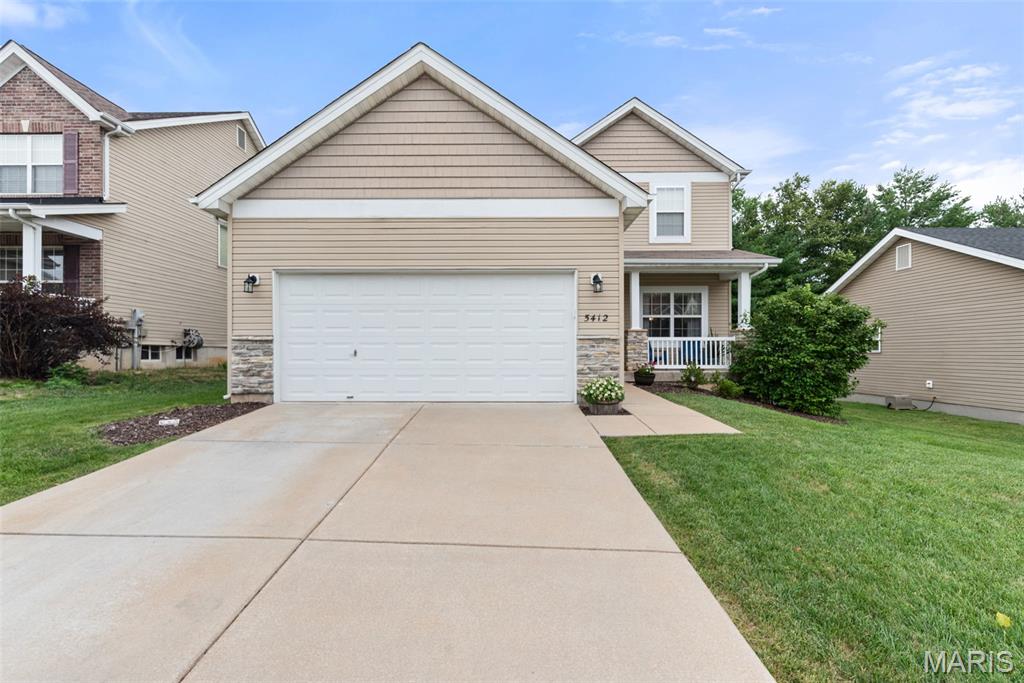 Welcome to 5412 Harter Farms Manor! This beautiful 2-story home offers 3 bedrooms, 3 full bathrooms, and 1 half bath, with plenty of space for comfortable everyday living and entertaining. Relax on the charming covered front porch before stepping inside to find hardwood floors throughout the main level. The spacious eat-in kitchen is the heart of the home, featuring a center island, abundant cabinet and counter space, and a sliding glass door that leads directly to the back deck—perfect for grilling, outdoor dining, or simply enjoying the private, fenced backyard. The property is also enhanced by an in-ground sprinkler system, helping keep the lawn looking its best all season long.
Upstairs, you'll find a conveniently located second-floor laundry room just steps from all three bedrooms. The spacious primary suite features a vaulted ceiling, creating an open and airy retreat. The hall bathroom offers an oversized vanity with plenty of counter space, making busy mornings a breeze. The finished lower level provides valuable additional living space, complete with a full bathroom and a large storage closet for all your organizational needs. The 2-car garage adds convenience and extra storage. Unlike many new construction opportunities where upgrades, landscaping, fencing, decks, window treatments, and other finishing touches can add significantly to the final purchase price, this home is move-in ready and already includes many of the features today's buyers want most. Enjoy the value of a finished lower level, fenced backyard, deck, sprinkler system, established landscaping, and recent major updates—all without the wait, uncertainty, or additional expense often associated with building new! Recent updates provide added peace of mind, including a brand-new roof installed in May 2026 and a new water heater. Located in the desirable Harter Farms subdivision, this move-in-ready home combines space, functionality, and valuable updates in a fantastic location. Welcome home to Harter Farms Manor! Cheers!