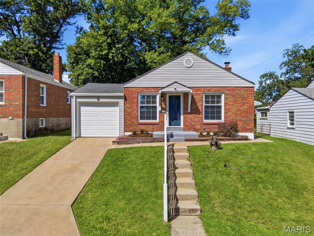 Welcome home to this charming brick bungalow offering comfortable living spaces, thoughtful updates, and a convenient location just minutes from Highway 70. From the moment you arrive, you'll appreciate the pride of ownership evident throughout, with modern improvements creating a home that feels both inviting and functional. Inside, the spacious living room is filled with natural light and flows seamlessly into the dining area, creating an inviting setting for everyday living and entertaining. The kitchen features stainless and black appliances, updated cabinetry finishes, and a built-in buffet that provides valuable additional storage and workspace. Just down the hall, two bedrooms share an updated full bath, while the versatile bonus room with backyard access offers endless possibilities as a home office, sitting room, fitness area, hobby room, dressing room, or flex space tailored to your needs. The lower level provides an expansive blank canvas ready for your vision. Outside, the spacious backyard is shaded by mature trees and offers plenty of room to relax, entertain, garden, or simply enjoy the peaceful setting. A one-car attached garage adds everyday convenience. Recent updates provide added peace of mind, including a new roof and air conditioning system in 2025, along with a newer furnace installed just a few years prior. Newer window treatments and neutral finishes further enhance the home's appeal. Combining custom-built ins, valuable mechanical updates, flexible living spaces, and easy access to shopping, dining, and major commuter routes, this must-see home is ready to welcome its next owner.