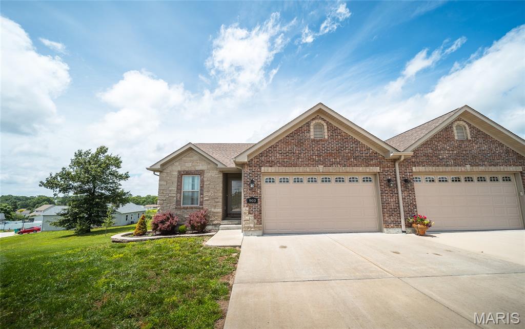 Enjoy easy, low-maintenance living in this spacious 3-bedroom, 3-bath villa located on a quiet cul-de-sac in the desirable Villas at Meadow Oaks. Built in 2021, this ranch-style home offers over 2,200 square feet of finished living space with an open floor plan designed for comfortable everyday living and entertaining.

The bright, inviting main level features cathedral ceilings, luxury finishes, and a beautifully appointed kitchen with custom cabinetry, granite countertops, stainless steel appliances, center island, pantry, and breakfast bar. The kitchen flows seamlessly into the dining and living areas, creating an ideal gathering space for family and friends. Step outside to the maintenance-free composite deck overlooking the backyard.

The primary suite offers a walk-in closet, walk-in shower, and private bath, while a second main-floor bedroom provides flexibility for guests or a home office. Convenient main-floor laundry adds to the home's functionality.

The finished walk-out lower level expands your living space with a large family room, third bedroom with walk-in closet, full bath, and ample storage space. An attached 2-car garage, public utilities, and a monthly HOA that includes lawn care and snow removal make this property perfect for those seeking convenience without sacrificing space.

Move-in ready and thoughtfully designed, this villa offers the best of one-level living with additional space when you need it.