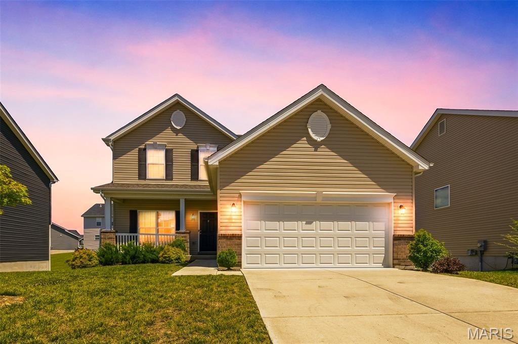 Welcome home to this stunning two-story, three-bedroom, two-and-a-half-bath single-family home in Wentzville, MO! Featuring attractive vinyl siding and an extended covered front porch, this home offers great curb appeal from the moment you arrive.

Step inside to a bright, open-concept floor plan with a stylish combination of luxury vinyl flooring and carpeting throughout the main level. The spacious living room features a cozy gas fireplace, perfect for relaxing on chilly evenings. The kitchen is equipped with stainless steel appliances, ample cabinet and counter space, and plenty of room for entertaining family and friends during holidays and special gatherings.

Upstairs, you'll find all three bedrooms, including a spacious primary suite with a private bathroom featuring double vanities, a separate shower, and a soaking tub. The conveniently located second-floor laundry room makes everyday living even easier.

The full unfinished walk-out basement provides endless possibilities for additional living space, storage, or a future recreation area. Step outside to the backyard, where there's plenty of room to add a patio or deck and create your ideal outdoor retreat.

Don't miss the opportunity to make this beautiful Wentzville home yours!