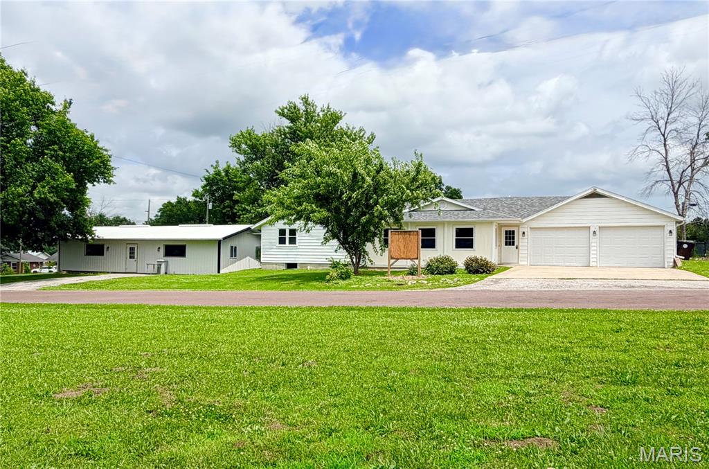 Exceptional Turnkey Commercial Opportunity in Perry, MO! Fully renovated and currently operating as a state-approved childcare center, this versatile property offers two commercial buildings in a prime location directly across from the city park. Whether you're an owner-operator, investor, or entrepreneur, this property is ready to generate income or accommodate your next business venture.  
The main building offers 2,348+/- sq. ft. and features a full kitchen, laundry room, private office, preschool classroom, toddler room, nursery, teacher lounge, storage room, indoor play gym, and three bathrooms. The second building includes 1,250+/- sq. ft. with a full kitchen, bathroom, and large open classroom, creating endless possibilities for expanded enrollment, separate age groups, after-school programs, or additional educational services.. Both buildings have secure, fenced playgrounds and are fully equipped for childcare operations. Both buildings are being sold "fully furnished" which makes the buildings turn-key for the next owners.  
The flexible layout opens the door to a variety of commercial uses, including educational services, medical or therapy offices, community programs, nonprofit organizations, event space, or professional office suites. With kitchens already in place, the buildings also lend themselves to numerous service-based businesses.
Looking for residential potential? Subject to local zoning and approvals, these buildings could also be converted back into single-family residences, multi-generational living spaces, or VRBO rentals creating a unique investment opportunity.
With recent renovations, an outstanding location across from the park, and exceptional versatility, this is a rare opportunity to own a property that's ready to meet your business or investment goals.