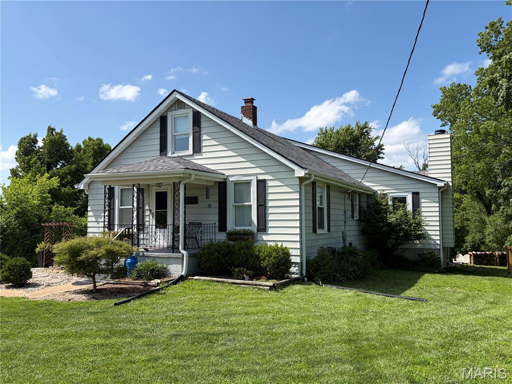 Nestled on an acre in highly sought-after Wildwood and within the award-winning Rockwood School District, this beautifully updated 1½-story home offers the perfect blend of privacy, space, and modern comfort. Featuring 3 bedrooms and 2 bathrooms, the home boasts an expansive kitchen with abundant cabinetry and storage, providing plenty of room for cooking, entertaining, and everyday living. The inviting living area is centered around a cozy wood-burning fireplace, creating a warm and welcoming gathering space. An extension off the garage provides a dedicated workshop with space for tools, equipment, hobbies, or additional storage, making it an ideal space for anyone needing extra room for projects. Thoughtfully maintained, the home has received an extensive list of recent improvements, including a new roof and HVAC system (A/C and furnace) in 2025, a new concrete driveway pad, water softener, complete sewer line replacement, and a beautifully renovated bathroom in 2024. Additional updates include a complete water line replacement in 2018, a new sump pump in 2026, and updated finishes throughout. Step outside to enjoy your own private retreat, complete with a custom-built fire pit perfect for relaxing evenings or entertaining. Offering the tranquility of a spacious, wooded setting while remaining near shopping, dining, parks, and top-rated schools, this move-in-ready home is a rare opportunity in one of Wildwood's most desirable locations.