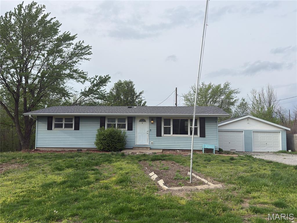 Quaint country setting on the outskirts of town that offers a little bit of space and nice privacy.  Nestled on just under 1 acre with 2 bedrooms and 2 baths on the main level, and rec room, family room, and additional sleeping room in the basement.  2 car detached garage offers great parking and storage opportunity.