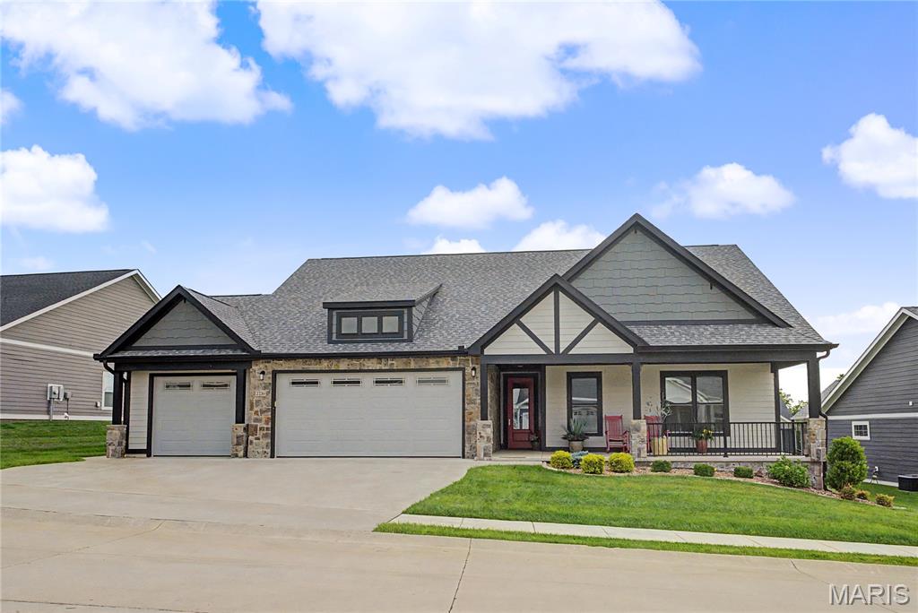 Experience refined living in this exceptional ranch-style home, thoughtfully designed with elegance, comfort, and effortless entertaining in mind. At just two years old, this beautifully appointed residence offers over 1,900 square feet of finished living space, all conveniently situated on one level.

From the moment you arrive, the inviting front porch sets the tone for what awaits inside. With ample space for any décor, it creates the perfect welcome for family and guests alike.

Upon entering, you will be greeted by a light-filled open floor plan where sophisticated design meets everyday functionality. The living room serves as the centerpiece of the home, featuring a soaring ceiling, custom built-ins, and a stunning fireplace that creates the perfect gathering space.

Just beyond, the beautifully appointed kitchen offers gorgeous cabinetry, abundant workspace, premium finishes, and a spacious walk-in pantry that will delight even the most discerning home chef. The seamless flow between the kitchen, dining, and living areas creates an atmosphere ideal for both intimate gatherings and large-scale entertaining. As a bonus, all kitchen appliances will remain with the home, making your move even more convenient.

The thoughtfully designed floor plan features three generously sized bedrooms and two luxurious full bathrooms, while the oversized three-car garage provides exceptional space for vehicles, recreational equipment, and additional storage. The impressive primary suite is a true retreat, featuring a spa-inspired bathroom complete with a HUGE walk-in shower, dual vanity, and abundant space to start and end your day in comfort. The grand-sized walk-in closet offers exceptional storage and serves a dual purpose as a reinforced safe room, providing peace of mind during severe weather events.  Nearby, you will find the well-appointed laundry room designed with both function and style in mind. Complete with cabinetry, a utility sink, and front-load washer and dryer that will remain with the home, this space makes everyday chores effortless while providing additional storage and workspace.

Throughout the home, you'll appreciate the beauty and practicality of hard-surface flooring, with absolutely no carpet to maintain, creating a clean and timeless aesthetic.

Outdoor living reaches a new level with the enclosed patio retreat. Complete with privacy shades, a mounted TV, and stylish furnishings that can remain with the home, this space offers the perfect setting for relaxation. Nearby, the custom-built grilling station invites you to host unforgettable cookouts as well.   The professionally designed landscaping has already been installed, allowing you to immediately enjoy the home's polished curb appeal and outdoor beauty.

Nestled within the highly desirable Walden Park community in Cape Girardeau, residents enjoy exclusive access to outstanding amenities including a clubhouse, fitness center, and resort-style swimming pool. Combined with convenient access to shopping, dining, healthcare facilities, and major thoroughfares, this remarkable property delivers the perfect balance of luxury, convenience, and lifestyle.

Homes of this caliber, offering nearly new construction, upscale finishes, outstanding community amenities, included appliances, and effortless single-level living, are a rare find. Prepare to be impressed and discover why this exceptional property stands out from the rest.