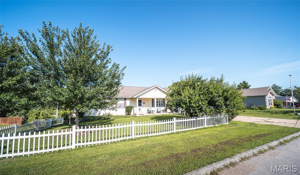 Welcome home to your own private oasis in one of Dixon's most desirable, well-established neighborhoods! This beautifully maintained 3-bedroom, 2.5-bath ranch offers the perfect blend of comfort, functionality, and spaces designed for making memories. Whether you're hosting family gatherings or enjoying a quiet evening at home, you'll appreciate the spacious floor plan and thoughtful updates throughout. The heart of the home is the oversized kitchen, featuring abundant cabinetry, generous counter space, and a dining area that's perfect for everything from weeknight dinners to holiday celebrations. Beautiful wood flooring adds warmth and character, while the upgraded UV water filtration system provides added peace of mind. The ADA-accessible hallway bathroom and newer back deck—just one year old—offer convenience and accessibility for years to come. The finished walk-out basement expands your living space with a large family room, wet bar, half bath, and plenty of storage, making it an ideal spot for entertaining. An oversized workshop with heating and air conditioning is easily accessible from the lower-level garage, providing the perfect space for hobbies, projects, or additional storage. Step outside to a fenced backyard built for fun, complete with an above-ground pool, a brand-new liner (included), solar cover, gazebo, umbrella, lights, basketball hoop, and pool accessories. With a two-car attached garage plus an additional lower-level garage for your mower or side-by-side, this home truly has it all. Conveniently located near the Oak Hills Country Club Golf Course, this is the lifestyle you've been waiting for. Schedule your private showing today before this exceptional home is gone!