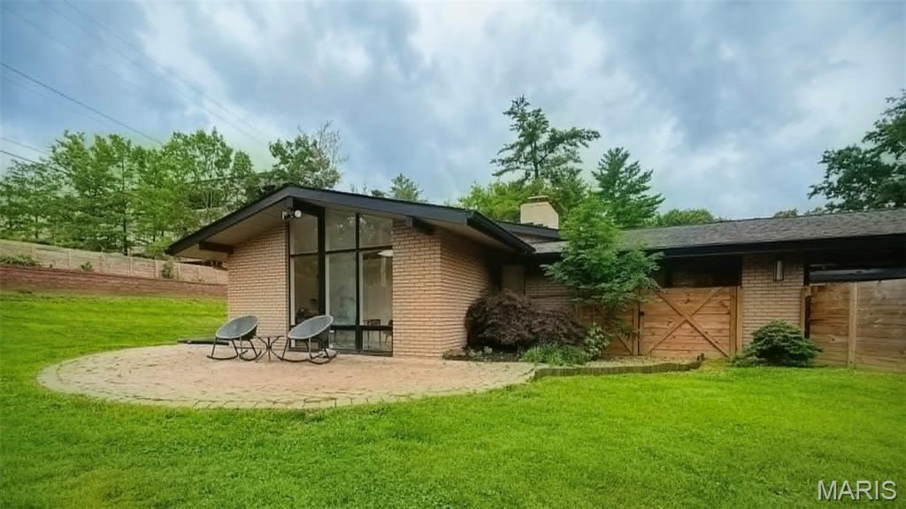 Architect-designed Ralph Fournier mid-century modern ranch on nearly half an acre in Sunswept. Iconic MCM elements include floor-to-ceiling windows, a dramatic see-through fireplace, skylight, and designer Nelson lighting. Exterior enhancements include dual modern garage doors with two-sided entry, custom mid-century entry doors, new asphalt driveway, professional landscaping, new sod, fencing, French drains, and a sculpted rear retaining wall. A serene Japanese-inspired garden with rare maples and evergreens completes the outdoor setting.

Interior updates feature luxury vinyl flooring, fresh paint, modern baseboards, architectural uplighting, LED cans, and trough lighting. The kitchen offers granite countertops, stainless appliances, and Delta Trask faucet; refrigerator, washer, and dryer stay. Spa-quality baths showcase floor-to-ceiling Carrara marble, floating vanities, bidet toilets, and European shower systems. The primary suite includes heated floors and a towel warmer.

Additional upgrades: newer electrical panel, Lutron switches/dimmers, AT&T Fiber wiring, Nest thermostat, full insulation replacement, attic pipe heat wrap, and driveway wiring for future landscape lighting. Located in Ladue Schools near premier private schools, parks, dining, shopping, highways, Lambert Airport, and STL attractions. Includes 2-10 Home Warranty. Buyer to verify square footage.
