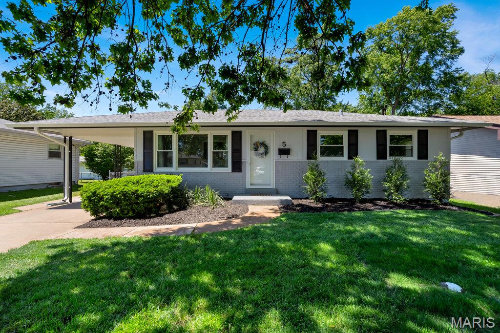 Beautifully updated ranch with great curb appeal, on peaceful tree lined street, over 2000 sq ft of living space, including awesome addition, which boasts family room with vaulted ceiling, wood burning fireplace, large primary suite with 2 closets and attached full bath with double sinks. Laundry, 2 more bedrooms and additional full bath, bonus room with built in bookcases and closet-great for office, playroom or sleeping area for guests.  Completely updated kitchen w/walk in pantry, and living room complete the main floor. Right outside kitchen and family room addition, you will find a large patio which is partially covered, enjoy it rain or shine.  Lower level features plenty of storage space, workshop area, 1/2 bath, rec room-could be great for a teen hangout space and/or sleeping area, bonus room w/closet-use for extra storage or craft room. So many options with this expanded main floor plan, plus finished lower level. Renovation completed 5/26 includes new: LVP, carpet/pad, kitchen cabinets, countertop, lovely tile backsplash, LG Stainless Steel appliances, sinks/faucets, ceiling fans, light fixtures, toilets, vanities/sinks/faucets in all 3 baths, baseboards, custom ceiling molding, most windows, fresh paint inside/outside. Large fully fenced, flat yard with ample patio accessible from kitchen and sliding glass doors in family room addition.  TRULY A MUST SEE to appreciate, much more spacious than it appears from the street. Close to shopping, restaurants, parks and a block from the elementary school.  SHOWINGS BEGIN 5/13 AT 3 PM.
