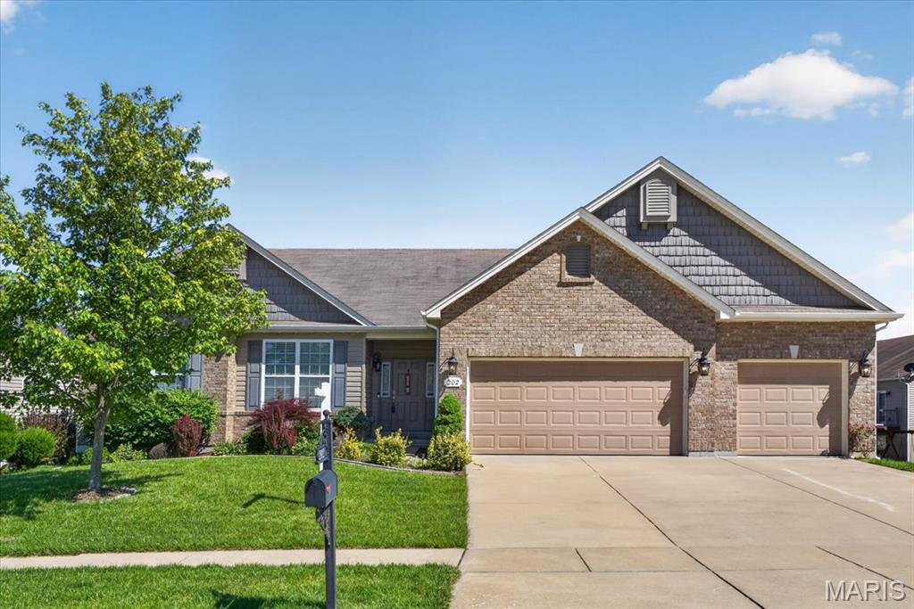 Absolutely beautifully maintained custom ranch in desirable West Hampton Woods! Offering over 3,500 sq ft of living space, 5 bedrooms, 3.5 baths, and a 3-car garage. This spacious home features an open floor plan with 9-foot ceilings, a large great room with fireplace and wall of windows, formal dining area, and a designer kitchen complete with granite countertops, center island, tile backsplash, stainless steel appliances, pantry, and abundant cabinetry. The breakfast room opens to a composite deck overlooking the level backyard, where a charming gazebo and pergola create the perfect outdoor retreat for relaxing, entertaining, or enjoying peaceful evenings at home.
The divided bedroom floor plan includes a luxurious primary suite with a spa-like bath, soaking tub, separate shower, double vanities, and walk-in closet. The finished lower level offers additional living and entertaining space with extra bedrooms, full bath, and flexible recreation areas ideal for guests, hobbies, or multi-generational living. Located in the highly sought-after Wentzville School District with convenient access to parks, shopping, restaurants, and highways. A true move-in ready home with space, style, and comfort throughout!