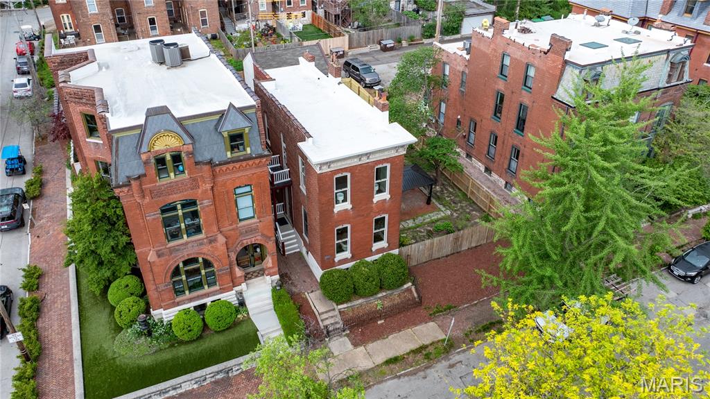 NEW PRICE of $469,9000 AND $10,000. CLOSING COST CREDIT or a bigger price reduction or use as a 2/1 buy down!! ACT NOW BEFORE SOMEONE ELSE DOES! Step into this beautifully renovated home where thoughtful updates meet timeless character. A new TPO roof, EV charging station, and a spacious two-car garage set the tone for modern convenience, while newly refinished original wood floors and updated lighting and plumbing fixtures, plumbing stacks, and copper water lines along with updated  electric enhances the home throughout.

Showcasing the heart of the home is the redesigned kitchen, featuring a new island and sleek Frigidaire stainless steel appliances—perfect for both everyday living and entertaining along with the spot on backsplash and under counter lighting.  This kitchen helps the chef make all the food yummy!  This home offers two wood-burning fireplaces, including a charming wood burning stove, adding warmth and character.

 Upstairs, the primary suite is a true retreat, complete with a private deck overlooking the yard, a spacious walk-in closet, and a beautifully appointed bath with a large shower. A second-floor laundry adds convenience, with an additional laundry setup in the basement.

The upper level also includes a generously sized front bedroom and a second full hall bath (tub shower combo). The semi-finished lower level offers incredible potential.  Featuring a private-entry or direct access from the main level.  A new full bath—ideal for a guest suite, office, or income-producing opportunity, as zoning allows.  This property is zoned multi-family.

Situated on a rare double lot in the upper quadrant of Soulard, this property offers space seldom found in the area—plenty of room to create your own outdoor oasis, even a pool. The original wrought iron fence stands as a nod to the home’s history, while its location in sought-after Soulard Heights places you just moments from the neighborhood’s vibrant energy, festivals, and charm.
2 car garage with an additional off street parking space for that treasured golf cart and space to add more parking should you need it.
New plumbing, new electric, new fixtures, fresh paint, newly refinished original wood floors, so much is offered here.  Come look.  Call the Realtor that has always  Sold Soulard Always Sold the City 30 plus years and counting!