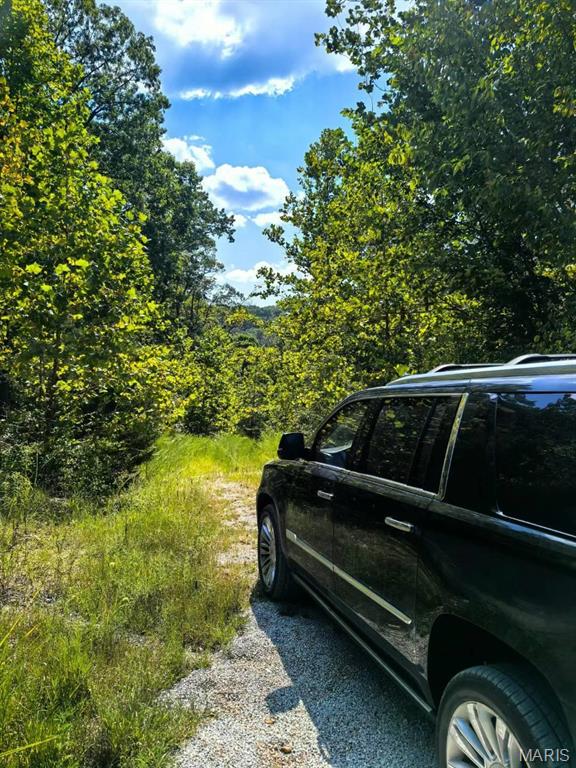 Secluded lot in Rockwood School District-only 4 miles from Hwy. 44. Private, Wooded, 4 acres in AAA ROCKWOOD SCHOOL DISTRICT WITH LOWER JEFFERSON COUNTY TAXES! Custom home site. Min. 2000 sf. for ranch, 2300 for 1.5 sty., 2500sf for more than 1.5 sty. Great investment opportunity!
An exceptional build-to-suit opportunity in the established community of Meadowbrook Valley Estates, offering approximately 4 acres of private, wooded land ideally suited for a luxury custom residence. This property presents a compelling option for custom home builders, design-build firms, and discerning end users seeking a premium homesite in a highly desirable location. Situated within the top-ranked Rockwood School District and benefiting from low Jefferson County property taxes, the site offers long-term value and broad market appeal. The natural topography and mature tree canopy provide an ideal backdrop for a thoughtfully designed estate home with outdoor living spaces, privacy buffers, and scenic views. Located approximately 4 miles from I-44, the property offers convenient access to St. Louis, Chesterfield, and major employment centers, while maintaining a tranquil and secluded setting. Protective subdivision standards ensure architectural consistency and enhance resale value, making this an attractive platform for a build-to-suit custom home program. This homesite is well-positioned for collaboration between builder and buyer, offering flexibility in design while preserving the integrity and exclusivity of the surrounding community.