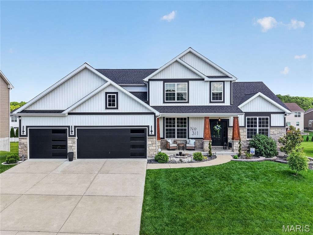 Prepare to be WOWED!  This 5 bedroom, 4.5 bath, 1.5 story home offers 4,464 sq ft of spectacular living space and a resort-like back yard complete with inground pool, custom paver patio, firepit, play area, hot tub and more.  The exterior is stunning with stone, board and batten vertical siding, craftsman columns, incredible landscaping, lawn irrigation, horizontal plank modern garage doors, built in soffit lighting and a custom stone mailbox.  The interior is a showcase of design, decoration and exquisite finishes.  Features include luxury vinyl plank flooring, 9 foot ceilings on the main, large Great Room with window wall, gas fireplace with stone and plank surround, white 42 inch cabinets with crown, granite countertops, tile backsplash, island with seating bar, walk in pantry, stainless steel appliances, bay window that walks out to a composite deck and steps to the pool area, main floor primary suite, deep coffer ceiling, custom accent wall, walk in closet, luxury Primary Bath, raised height double vanities, granite vanity tops, free-standing soaking tub, custom tile shower, semi-frameless shower doors, an Office/Dining Room, main floor laundry room with wash sink and wall cabinets, personal storage cubbies and so much more.  The upstairs has 3 bedrooms (all with walk-in closets), 2 bathrooms and a huge Bonus Room.  There is a hi efficiency, dual HVAC system, 50 gallon water heater and an oversized 3 car garage with an epoxy floor, insulation, full drywall and paint.  The finished lower level has a Family Room, incredible wet bar, built in wine rack, full bathroom, home theater, recreation area, under the stairs kids funhouse and an Office/Bedroom with egress window and walk in closet.  The decorating is impeccable and the finishes are top notch.  The walkout, lower level leads you to an outdoor oasis that is captivating beyond measure.  You will feel like everyday is vacation in this picturesque setting.   The yard is level, fenced and tree lined.  There are no words to fully capture this house, its a MUST SEE!