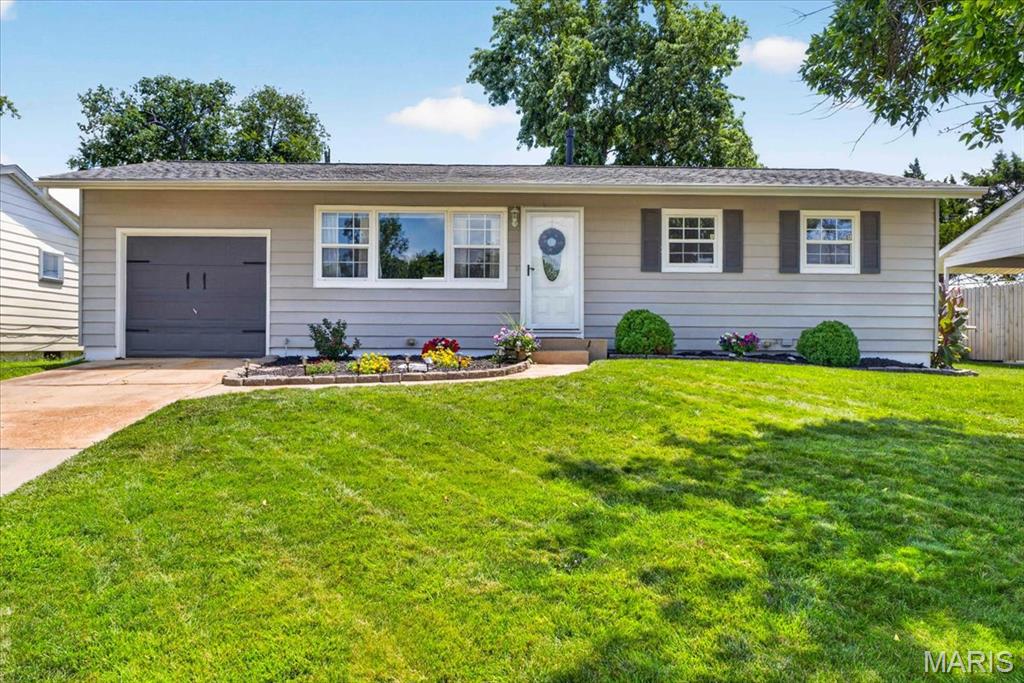This beautifully renovated 3-bedroom ranch blends timeless charm with modern finishes throughout. The stunning kitchen features custom cabinetry, granite countertops, stainless steel appliances, a classic subway tile backsplash, and stylish luxury vinyl plank flooring. The spacious full bathroom has a custom vanity, subway tile accents, a tiled tub/shower surround, and matching ceramic tile flooring. The open-concept layout is highlighted by gleaming hardwood floors, crown molding, and abundant natural light, creating a warm and inviting living space. The finished lower level adds exceptional versatility with two large finished living areas, plus a dedicated storage room. Step outside to enjoy the fully fenced backyard, complete with a spacious deck for grilling, a fire pit for relaxing evenings, and plenty of room for kids and pets to play. Additional highlights include a one-car attached garage, newer windows, updated lighting, six-panel doors, and pride-of-ownership landscaping. Move-in ready and thoughtfully updated from top to bottom, this home offers the perfect combination of style, function, and comfort.