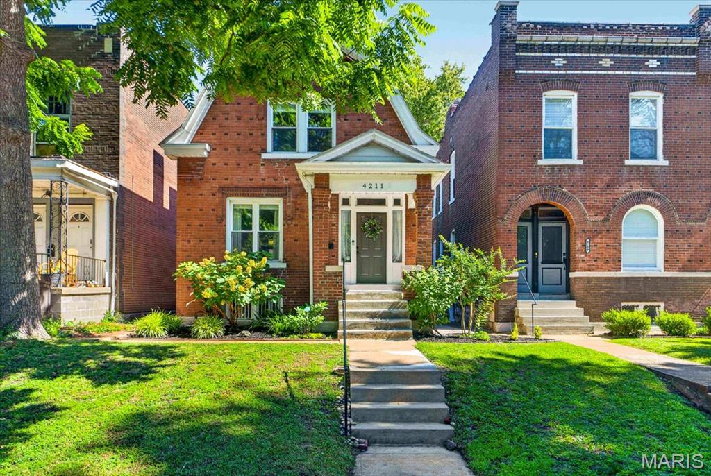 A place to plant roots. A place to make memories, and to build community... welcome to Hartford Street! Just one block from Tower Grove Park, this 1912 brick two-story pairs classic South City character with one of the neighborhood’s most coveted locations. On a tree-lined street where park walks, local restaurants, and events bring the community together, the neighborhood is part of the experience. Set apart by its polished landscaping and curb appeal, notice the mosaic tile upon entry to the covered front porch. Inside, city charm & character carry through a functional, bright main floor featuring hardwood floors, crown molding, and 9 ft ceilings. The living room opens to a separate dining room, where stained glass windows and new lighting bring warmth to this gathering place. A half bath on the main floor offers convenience. The renovated kitchen pairs updated finishes with stainless steel appliances (fridge included!), ample cabinetry and quartz counters. Step outside to the deck for quiet evenings under the string lights or gatherings in the yard; a level, fenced green space made perfect for gardening, pets, game nights, & more. Convenient 3-space parking pad included! Upstairs, two bedrooms share a renovated full bath w/ a custom tile shower & modern vanity. The primary bedroom includes dual closets—an especially-welcome feature in a historic home! Updates to note: a newer roof and gutters installed in 2023, and new plumbing under the home in 2024. The unfinished basement is clean, offering storage and hobby space. A few steps from favorites like Hartford Coffee Company, Local Harvest Grocery, and the wonderful experiences at Tower Grove Park. A place for slow mornings - to grow into and gather often, Hartford Street captures the best of city living on a historic street. Take a tour today!