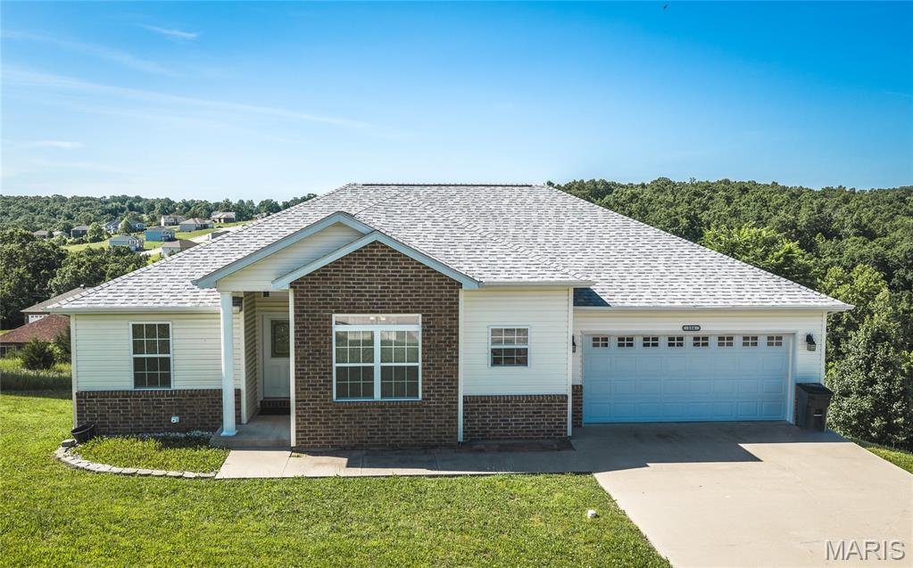 Welcome home to this beautifully maintained 4-bedroom, 3-bath residence located in one of the most desirable neighborhoods in St. Robert. Conveniently situated just a short drive from Fort Leonard Wood, this home offers the perfect combination of space, comfort, and modern updates in a location that puts everyday conveniences within easy reach. Step inside and discover an inviting open floor plan designed for both entertaining and daily living. Luxury vinyl plank flooring flows throughout the home, creating a seamless and stylish feel while offering durability for busy households. The spacious kitchen serves as the heart of the home, providing plenty of room for preparing meals, gathering with family, or hosting guests. The oversized primary suite offers a private retreat at the end of the day, complete with a generous walk-in closet and an ensuite bathroom designed for comfort and convenience. Downstairs, the partially finished basement expands your living space with a large family room perfect for movie nights, game days, or a play area, while additional storage space helps keep everything organized. Outside, you'll love spending time on the partially covered back deck, where beautiful views create the perfect backdrop for morning coffee, evening relaxation, or outdoor entertaining. A new roof installed in 2025 adds peace of mind and long-term value. Homes in this sought-after neighborhood don't come along often. Schedule your private showing today and experience everything this exceptional St. Robert home has to offer!