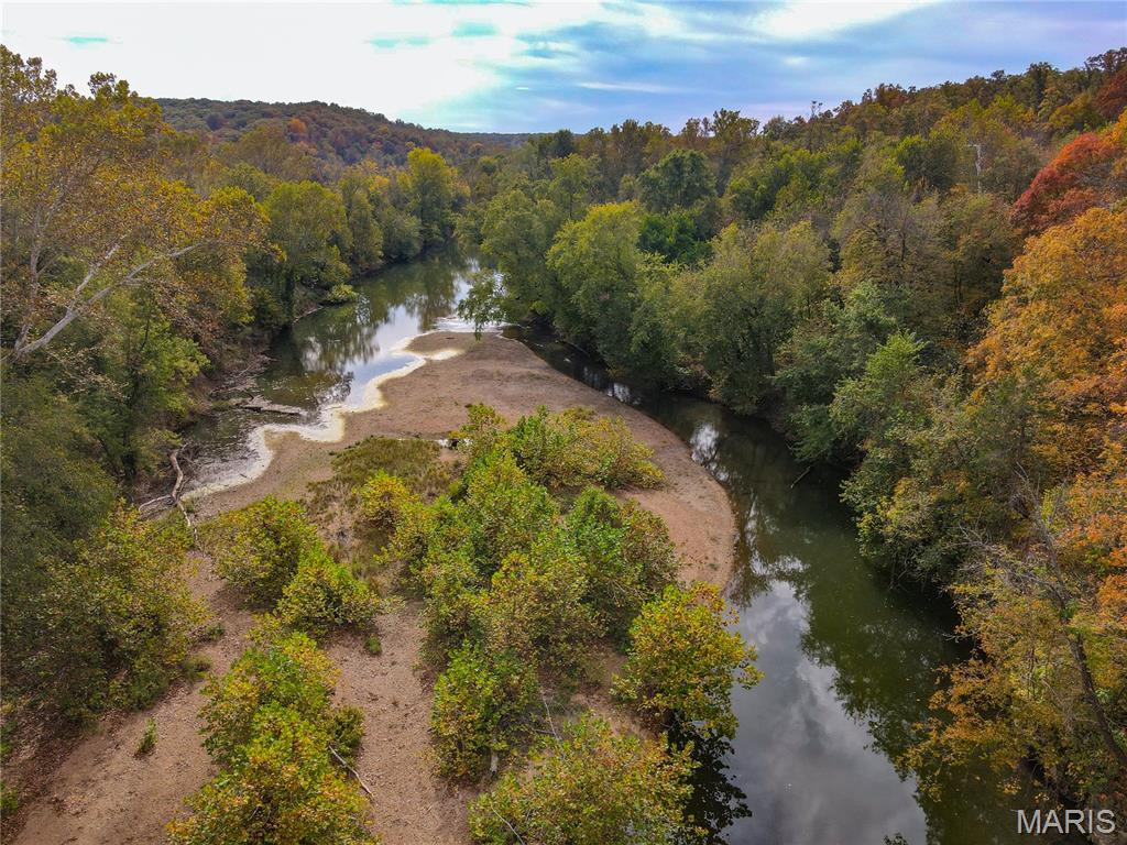 Great opportunity for any outdoorsman!  Over 40 acres with Big River access featuring a rustic cabin on the hillside with electric, well, and septic including newer windows, roof and metal siding.  Other buildings on the property include an older barn and storage.  Enjoy your day riding your ATV or walking on the several trails throughout the wooded property.  Go fishing, hunting, kayaking or just relax on the gravel bar at the Big River waterfront access. There are 2 wells on the property and room to make your dreams come true. Whether you are looking for land to just relax and enjoy nature or make it your fulltime home this property is a must see.  Set up your showing to see all this property has to offer.
