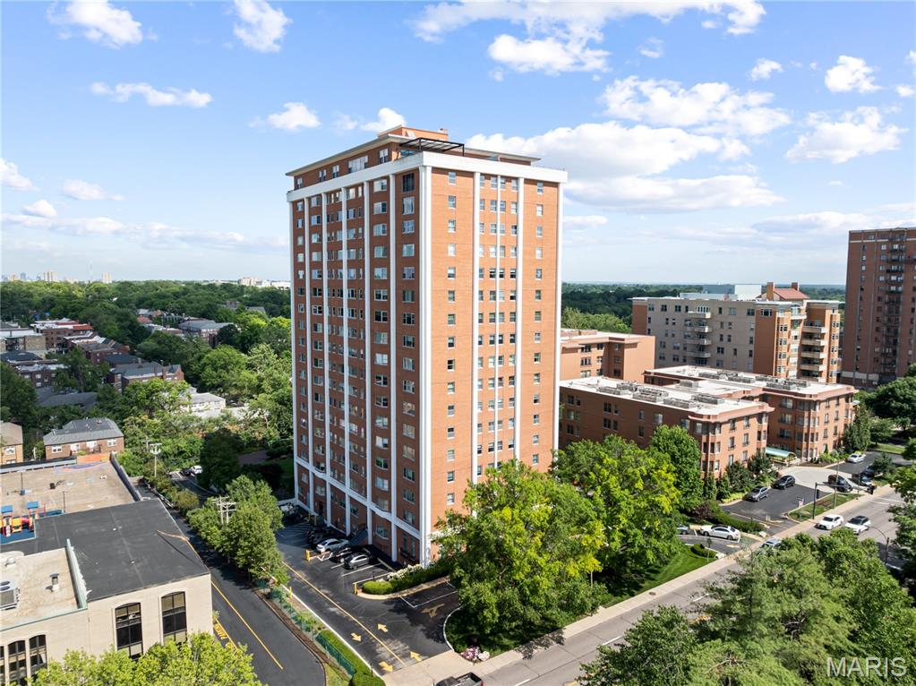 Welcome to The Whitehall, one of Clayton’s premier high-rise condominium communities and the only building offering truly unobstructed views of the Clayton skyline. Perfectly situated near award-winning restaurants, upscale shopping, parks, entertainment, and everything downtown Clayton has to offer, this beautifully updated 2-bedroom, 2-bath residence combines luxury, convenience, and community. Impeccably maintained and filled with natural light, this inviting condo features a thoughtful floor plan, beautiful hardwood floors, an updated kitchen, updated bathrooms, separate dining room, and the convenience of an in-unit washer and dryer. The spacious primary suite serves as a private retreat with a well-appointed ensuite bath complete with curbless shower and abundant closet space. Additional updates include added custom built-ins and all new wood doors. The Whitehall offers an exceptional lifestyle with resort-style amenities including a 24-hour doorman and concierge, fitness center, community library, swimming pool, beautifully landscaped grounds, guest suite, event space, elegant lobby, and welcoming gathering areas. Residents enjoy a vibrant social atmosphere with numerous community events designed to connect neighbors and foster lasting friendships. Complete with two assigned parking spaces in the secure garage, this exceptional residence offers the perfect blend of comfort, sophistication, and low-maintenance living in one of Clayton’s most sought-after communities.