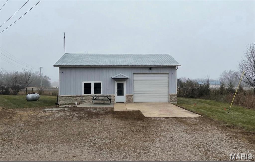-Duplicate Listing- MLS #26000271
This distinctive commercial property offers outstanding visibility from Interstate 44, providing exceptional exposure for businesses seeking a high-traffic, easily recognizable location. Formerly utilized as an ambulance shed, the building is well-constructed and thoughtfully laid out to accommodate a wide range of commercial uses. The property features a spacious garage bay ideal for service, storage, or light industrial operations, along with two private rooms currently configured as offices, allowing for administrative or client-facing functions. Additional amenities include a full bathroom and a functional kitchen area, enhancing day-to-day operational convenience.
The flexible floor plan allows for easy adaptation to suit office, service-based, or specialty business needs. With convenient interstate access, strong visibility, and versatile interior spaces, this property presents an excellent opportunity for an owner-occupant or investor looking to establish a professional presence in a highly accessible location.