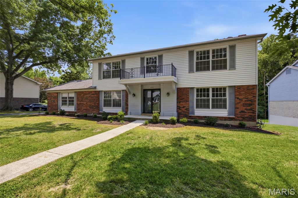This traditional single-family residence, built in 1970, features four Bedrooms, two full and one half bath is an attractive property in a convenient location.   The large two story foyer features gleaming hardwood floors, a staircase that winds up to the second floor and provides a great transition as you enter the home.  On the left is a large dinning room with easy kitchen access and to the right is a spacious living room.  Through the hall is a formal living room featuring beautiful detailed woodwork, a fireplace, and an exterior sliding door.  A freshly reimagined half bath completes the first floor.  This home offers a distinguished opportunity for discerning individuals seeking a well-maintained and thoughtfully designed living space. The kitchen is appointed with a double oven and a practical peninsula, designed to facilitate both culinary endeavors and social gatherings. A well-appointed bathroom features a walk-in shower, offering a blend of functionality and contemporary design. Further enhancing the property's appeal are a spacious basement and a conveniently attached garage, providing ample utility and storage solutions. We invite you to discover the refined living experience offered by this exceptional residence.