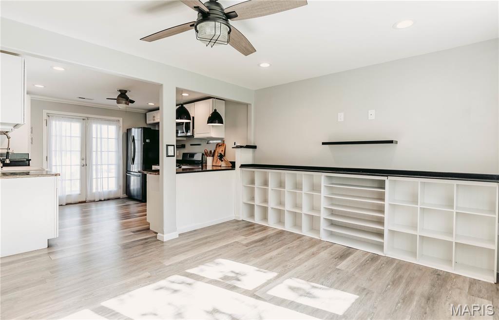 Plans changed, creating a chance to own this lovingly remodeled charmer! Updated top to bottom and move-in ready, this unique home offers a Tesla charger, freshened paint, added touches, and a few new fixtures. Inside, you’ll find a spacious 1 bedroom, 1 bath layout with a large laundry room/walk-in closet combination, built-in storage in the living room, and a beautifully detailed kitchen with abundant cabinetry, gas oven/range, refrigerator, built-in microwave, and dishwasher. Spray foam insulation in the walls and blown-in cellulose in the attic add comfort and efficiency. Exterior features include vinyl siding and windows, a metal roof, Rubidoux rock accents, plenty of off-street parking, and a welcoming front walkway that adds to the curb appeal. Step outside the french doors off the kitchen to enjoy the nice-sized backyard, paver-style patio, and a large Conex type/shipping container that stays with the property—great for storage, workshop space, or hobby use. This one is full of charm, function, and thoughtful touches.