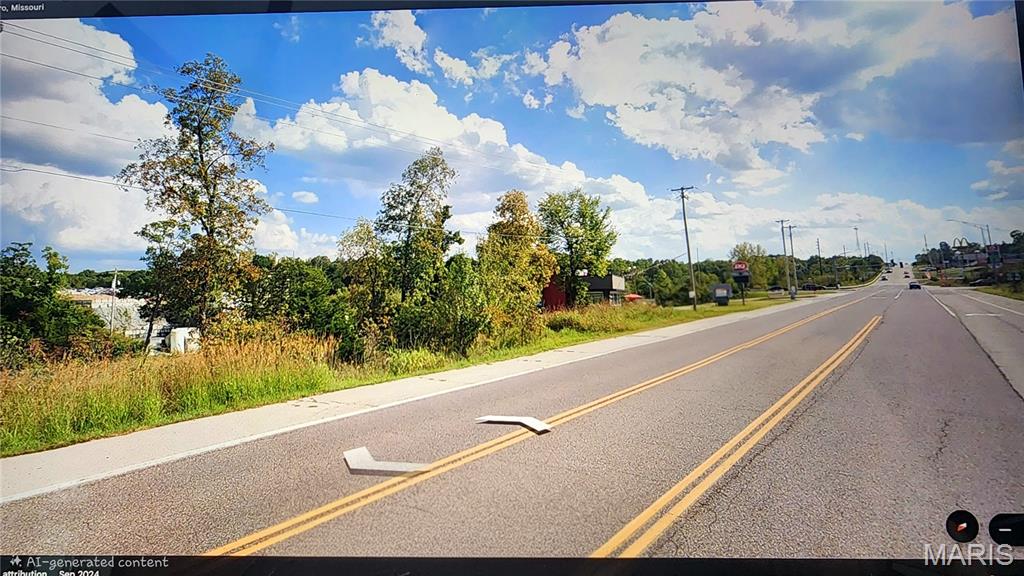 Commercial opportunity! +-1 acre in a high traffic count location suitable for fast food establishment, business center, gas station, mechanics shop and so much more. Seller is willing to clear as needed and is also willing to sell a larger portion of this 32 acre tract if desired. Water, sewer and electric are present. Dairy Queen is next door for a frame of reference while McDonalds and Taco Bell are adjacent along with a Circle K. 
Please call listing agent with questions.