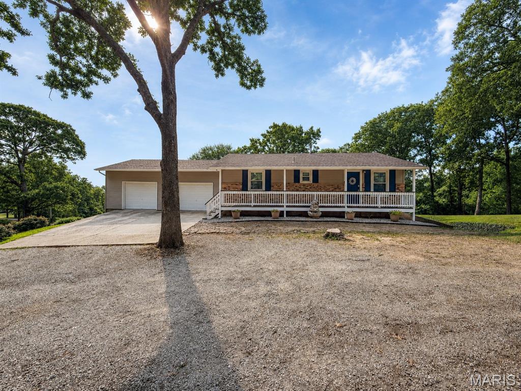 If you've been searching for breathtaking views, this is one! Enjoy views of the R7 Valley stretching all the way to the mighty Mississippi River a few months out of the year from your own backyard. This spacious 4- bedroom, 2-bath ranch offers open floor plan designed for comfortable, everyday living and entertaining. Main level features 2 bedrooms and a full bath, while the finished lower level includes 2 additional bedrooms connected with a Jack-N - Jill bath, plus a dedicated office -perfect for working from home also has the walkout lower level door. Step outside and discover what truly sets this property apart. Five wooded acres for recreational, hunting or endless possibilities. Kids will love the charming clubhouse tucked among the trees, while the large cleared yard offers plenty of room for a future outbuilding, workshop, garden, or play area. The impressive 35X12 brand - new deck is perfect place to relax, entertain family and friends or simple take in the incredible views overlooking your acreage.  The sellers have completed numerous upgrades with a detailed list available in the sellers disclosure for your review.  This property offers combination of acreage, views, location, and a top notch school district. Don't miss your opportunity to make this beautiful move -in- ready  your next place to call HOME!