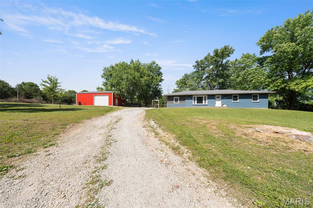 Welcome home to this charming 4 bedroom, 2 bathroom ranch nestled on 1.43 acres m/l at the end of a quiet cul-de-sac just minutes from Rolla amenities! This well-maintained brick home offers the perfect blend of comfort, space, and privacy. Step inside to a cozy living room and an inviting kitchen featuring a center island and beautiful tile backsplash. The dining area opens to a covered back patio, creating the ideal space for relaxing or entertaining. The primary suite includes a private full ensuite bathroom, while the spacious layout provides room for everyone. Outside, you'll find a detached 25x45 garage and a large fenced area perfect for children, pets, or garden. Located in a peaceful neighborhood, this property truly checks all the boxes. Schedule your private tour today!