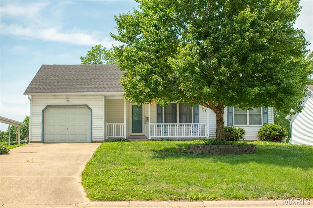 Welcome to this inviting 2-bedroom, 1-bath ranch offering 1,052 square feet of comfortable living space in the highly sought-after Washington School District. Built in 1991, this well-maintained home features a functional layout with the convenience of main floor laundry and plenty of natural light throughout. Step onto the covered front porch—perfect for morning coffee or relaxing evenings—and discover a home ready for your personal touch. Inside, you'll find solid construction and “good bones,” making it an ideal opportunity for buyers looking to add cosmetic updates and build instant equity. The unfinished walk-out basement provides excellent potential for additional living space, storage, or a custom finish tailored to your needs. Out back, enjoy a deck overlooking the yard—perfect for entertaining or simply taking in the outdoors. Conveniently located near the hospital, parks, shopping, and restaurants, this home offers both comfort and accessibility. Whether you're a first-time buyer, downsizing, or an investor, this property is full of opportunity.