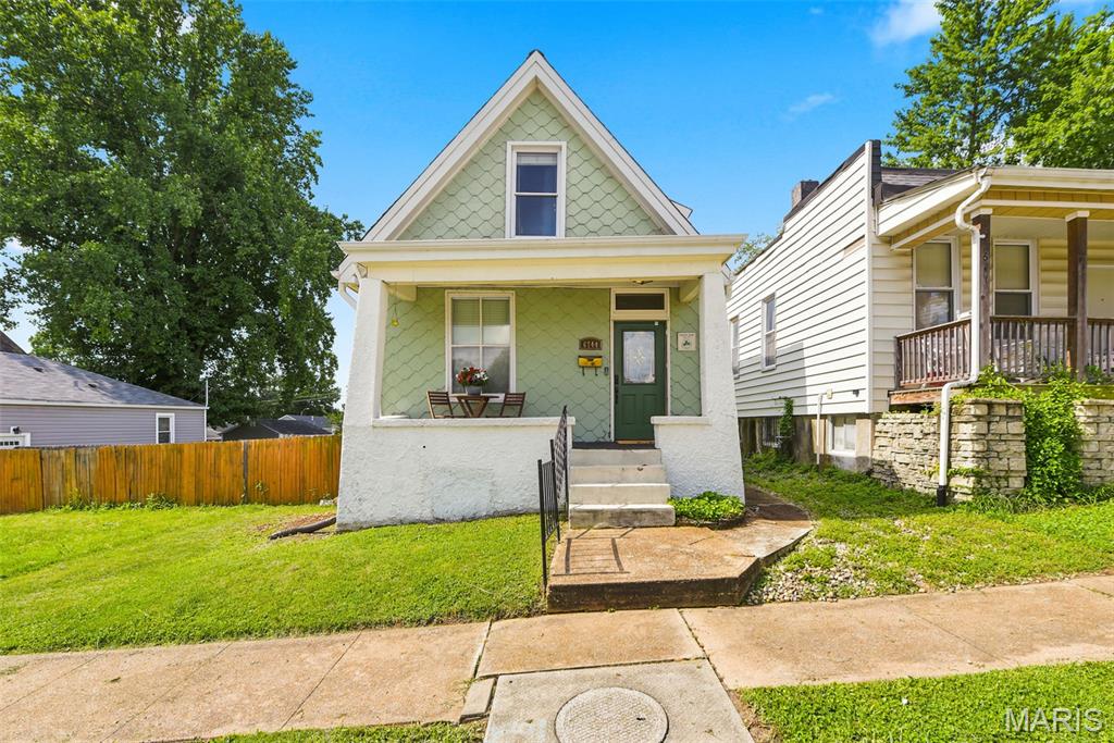 Welcome home!  Don't miss your opportunity to be the next owner of this darling property located in the Forest Park Home Place subdivision!  This charming "Century Home" offers 1,217 square feet of bright and inviting living space.  The A-frame style building features two bedrooms and one bathroom.  The two-story layout provides a seamless flow, perfect for both everyday living and entertaining. The main floor includes a spacious foyer, a living area, and a combined dining space. The kitchen is equipped with white cabinetry, granite countertops, stainless steel appliances, a coffee bar area, and a generous pantry.  The original 1910 Craftsman staircase leads to the second floor, which hosts two bedrooms with ample closet space, newer carpeting, and ceiling fans. The renovated full bathroom includes a shower/tub combo, a single sink vanity, designer lighting, and a linen closet.  For additional space, the full basement offers extensive storage or workshop potential, a laundry area, and a walk-out feature leading to the backyard. The outdoor space is ideal for entertaining, featuring a sizeable deck, privacy fenced-in yard, and a parking pad.  Nestled in the vibrant "Dogtown" community, you are just minutes away from Forest Park, the St. Louis Zoo, local pubs, and neighborhood eateries. With quick highway access and proximity to the annual St. Patrick's Day Parade, this is a rare opportunity to own a home in one of St. Louis's most legendary neighborhoods!