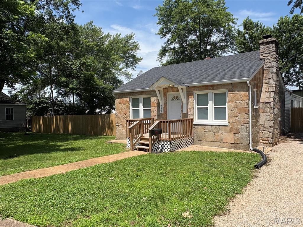 Very nice home with all the major updates completed: Newer roof, water heater, furnace, plumbing, flooring, six panel doors, sewer lateral, big shed with man door and overhead door, front deck, 6 ft wood privacy fence and extra large parking area with all new gavel! All electric, main floor laundry, full basement, wood burning fireplace.