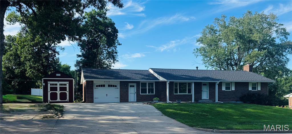 Welcome home to this updated full-brick ranch offering approximately 3,000 square feet of living space, 3 bedrooms, 2.5 baths, and a finished lower level. The kitchen is truly the centerpiece of the home, featuring a large granite center island, an incredible amount of cabinetry, glass-front display cabinets, black stainless appliances, farmhouse sink, subway tile backsplash, and pantry. Hardwood flooring flows through the living room, kitchen, and hallway. The spacious primary bath features an impressive 11.5-foot vanity with dual sinks and an Onyx walk-in shower. Just off the kitchen, you'll find a large dining room and convenient half bath. The sunroom, added in 2023, offers additional living space with a wood accent wall and plenty of natural light. The finished lower level provides endless possibilities with a dedicated workspace complete with cabinetry and an island—perfect for crafts, sewing, hobbies, or a home office. A large family room with a wood-burning fireplace and a full bath complete the lower level. Additional updates include replacement windows, all interior and exterior doors replaced. Furnace and air conditioner 2019. Washer and dryer will stay.  The home also offers a one-car attached garage plus additional parking spaces in front. This well-maintained home combines quality updates and generous living space. Seller's disclosure not available #lovewhereyoulive