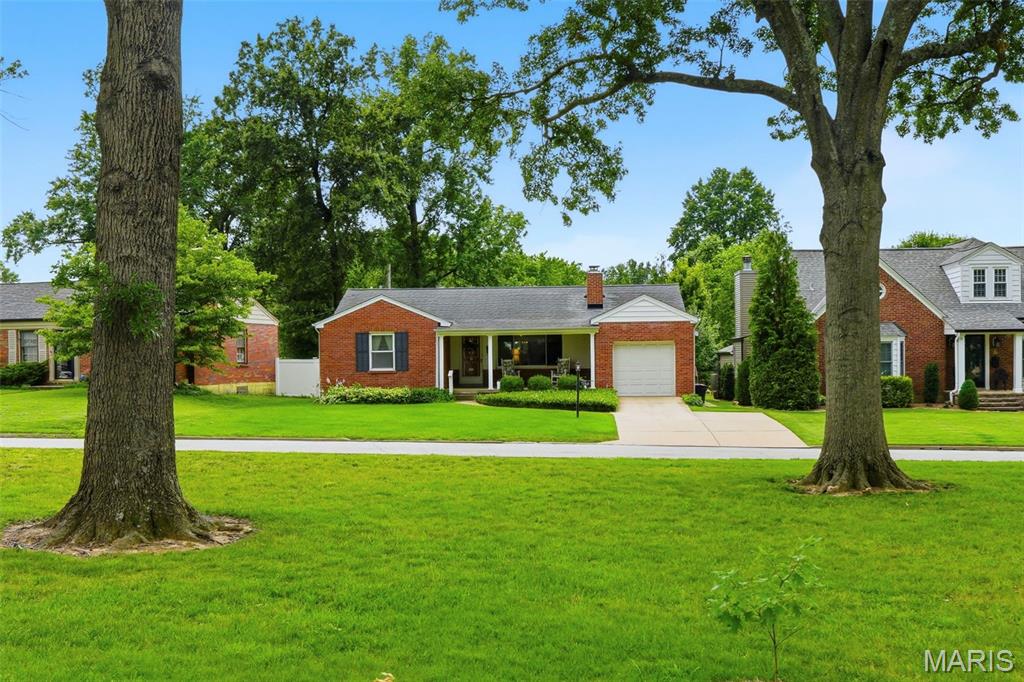 This is the sweetest location you will find! Sitting on your shaded front porch you can enjoy the view of a delightful pocket park right across the street - it's such a great neighborhood feel! And the full brick home itself is so appealing with its handsome fireplace, generous dining room with another great view of the lush, flat back yard, cheerful kitchen, 2 spacious bedrooms, bright remodeled bath, replacement windows, full basement with washer and dryer included and second full bath. And let's not forget great, thoughtful maintenance! It's the pick of the crop out there!