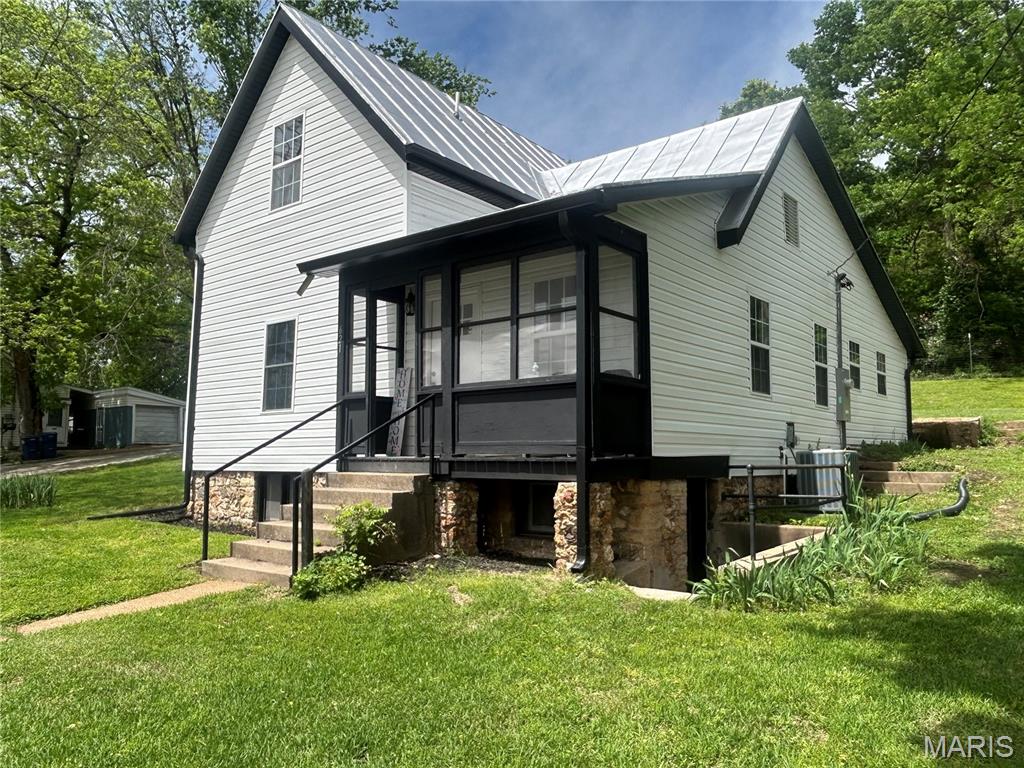 Historic Charm meets Modern Remodel , it's the best of both worlds. This home has been elegantly remodeled and no expense has been spared. The home has a new furnace and ac with new duct work , new windows, siding and guttering. The home has new plumbing and electrical all updated to code. New interior and exterior doors, base, paint, light fixtures, and new flooring. Kitchen has new cabinets, countertops, sink, and appliances. Master bathroom is its own little paradise with the original clawfoot free standing tub and custom tiled shower with custom fixtures. A main floor bathroom and upstairs bathroom were added to the floor plan. 
The best part is it is located in town close to parks, restaurants , cafes schools, shopping and minutes from 
I-44 Hwy. yet has plenty of privacy and has a peaceful back yard.  Also has a small shed for storage. It is not in a flood plain and has beautiful views from both sides of the  house. This home has too many items to mention! Make your appointment today to see this beautiful transformation and call this home your own!  Did I mention the seller is also paying for a 1 year choice home warranty!