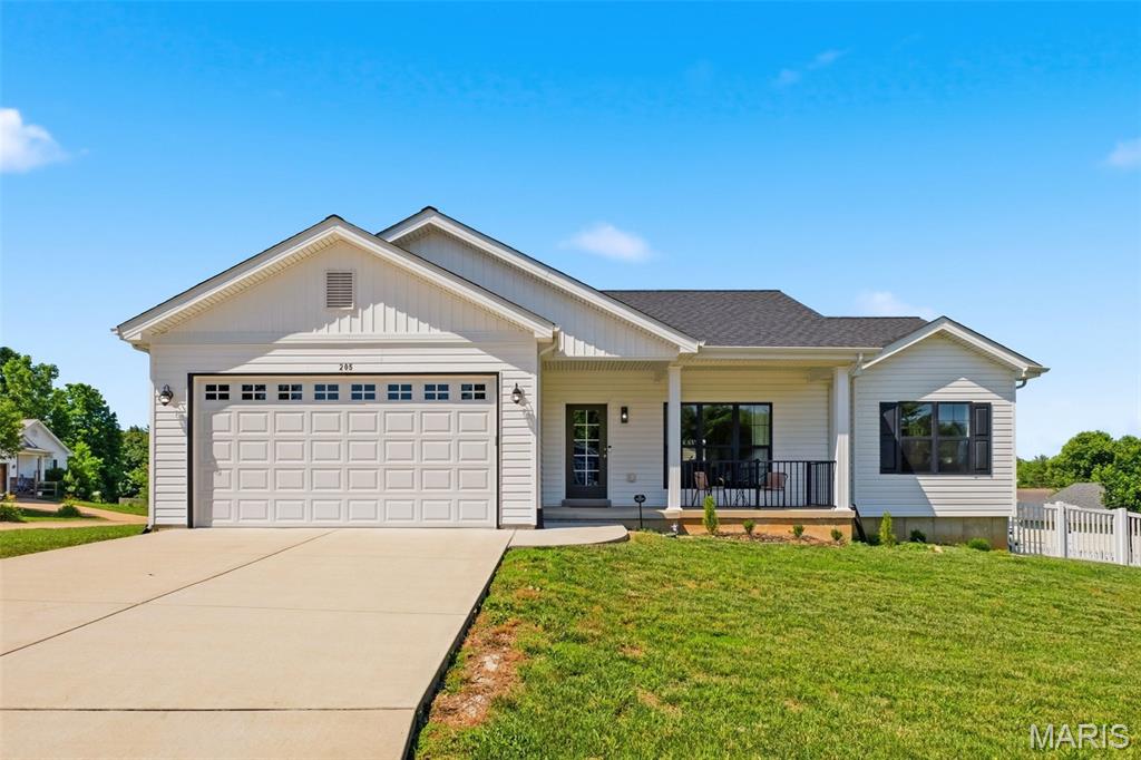 This well-appointed, three-year-old ranch home offers 3 bedrooms, 2 full baths and modern comfort in the heart of Winfield, combining stylish finishes with easy one level living. You will love the spacious corner lot with a new vinyl fence, a beautiful new deck and maple trees that provide curb appeal and great shade in the future. Step inside to find an open concept floorplan with luxury vinyl plank flooring throughout, a spacious living room and beautifully appointed kitchen with a center island, stainless steel appliances, a contemporary backsplash, upgraded cabinets and canned lighting. The beautiful master bedroom suite features coffered ceilings and overhead lighting. The lower level is awaiting your finishing touches and includes an egress window for a future 4th bedroom. Additional upgrades to this home include black trimmed doors and windows, upgraded interior doors, Lennox Elite HVAC system, architectural shingle roof, main floor laundry and oversized garage door. This home combines style, comfort and functionality and just minutes from schools, grocery and shopping. Make this your new home today!