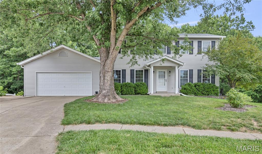 Darling 2-story with private and serene backyard. Cul-de-sac lot with common ground on one side of home separating it from neighbor and backs to trees with Fort Zumwalt Park hidden behind them offering great walking trails right out your back door. The 2 car garage is oversized with a service door that leads to the 3rd car pad on side of home useful for parking a boat, RV, camper or extra car. 
Main level and bathrooms are all updated including LVP flooring, white paneled doors and baseboards, newer windows and trim.
Walk-out your LL with laundry and possible 4th bedroom into the tiered backyard with extensive retaining walls, rock under deck, paver patio and stone steps to the treelined edge of yard. Above ground pools, fencing of all kinds are allowed in here with no active HOA. 
Dining room and large family room with option for breakfast room on main level. Pantry, coat closet, linen closet and walk-in closet along with plenty of storage room in basement. Upper level has 3 bedrooms updated master bath with ceramic tile, attic fan and ceiling fans in all rooms. This home is truly a labor of love and reflects a decade of efforts per seller painstakingly updating.