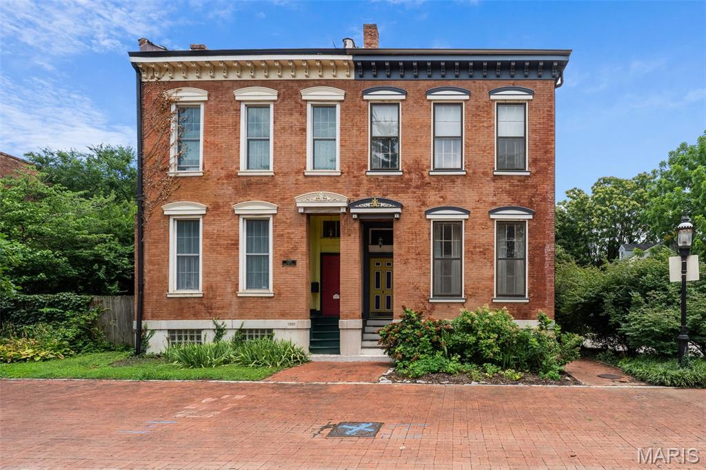 An incredibly curated pad with a creative art house vibe awaits on this pedestrian promenade in hidden La Salle Park. A designer's eye & aesthetic sets the tone to the unexpected layout & serene setting, yet architectural elements remain with a sweeping original stairwell, historic hardwoods & carved exterior facia & exposed brick accents throughout.  The vast main levels double as entertainment, dining & living areas with an amazing built-in bar & 2 decorative fireplaces. Even the kitchen is high design w/ angled open shelving & a built-in breakfast bench in the bay window with a bonus room that leads to the quaint courtyard. A mix of eclectic & industrial elements are a "creative's" dream come true with workshop, sewing studio and endless wallspace in the gallery like levels above to display your one-of-a-kind works. Movin' on up the second level is a respite for relaxing with a primary suite that faces the pedestrian mall & a well appointed spa-like primary bath.  A second bedroom has it own full bath for sharing space & a lounge for relaxing lies in between with an exposed beam ceiling. Look up & follow the soaring stairs to the loft above with a bedroom sleeping area &chill spot to perch in or on the outdoor veranda. The sweet location & historic neighborhood complete the package. You'll be situated on a quaint cul-de-sac with offstreet parking, access to events and area attractions in a residential neighborhood with strong community & deep roots.