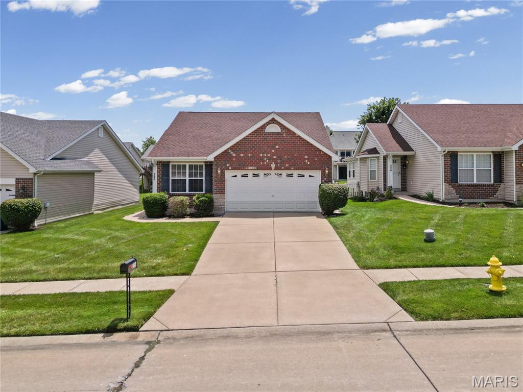 Welcome home to this original-owner 2-bedroom, 2-bath villa designed for easy, low-maintenance living. Nestled in a quiet neighborhood, you'll enjoy peaceful surroundings just minutes from major highways, shopping, and everyday conveniences. From the moment you arrive, the brick and stone veneer exterior, paired with professional landscaping, creates beautiful curb appeal. Inside, the open floor plan offers the spacious layout today's buyers are looking for. The kitchen comes fully equipped with all appliances, and the newer roof provides added peace of mind. The spacious primary suite features a private bath with both a soaking tub and separate shower. Main floor laundry adds everyday convenience, while the clean, unfinished basement offers endless possibilities for future living space, a home office, workout room, or additional storage. Enjoy the benefits of a low $124/month HOA, which covers lawn mowing, landscaping, snow removal, and lawn irrigation allowing you to spend more time enjoying your home and less time maintaining it. Offering the perfect combination of location, comfort, and lifestyle, this villa is ready for its next owner. Floor plans are included at the end of the photos. Schedule your private tour today!