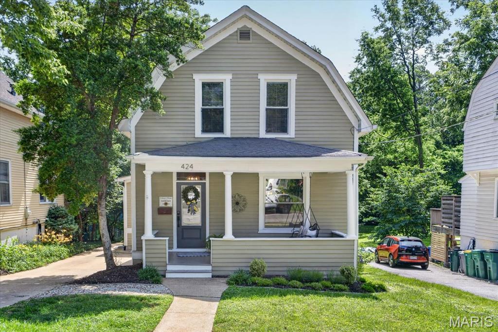 Welcome to 424 Spring Avenue — where historic Webster Groves charm meets modern living in one of the community’s most picturesque settings. A welcoming front porch sets the tone, inviting you to slow down and enjoy the timeless character that makes this home so special. Situated on a beautiful lot backing to a private walking path leading directly to The College School grounds, this exceptional 4-bedroom, 3.5-bath home offers the perfect blend of charm, space, and thoughtful updates. A stunning addition completed just ten years ago seamlessly integrates modern amenities while preserving the warmth and character that defines Webster Groves living. The addition features a spacious main-floor primary suite, a comfortable family room designed for everyday living and entertaining, and a finished lower level that significantly expands the home's functionality. Upstairs, you'll find three additional bedrooms and a full hall bath. The finished lower level includes a large recreation room, an additional sleeping area with an egress window, a full bath, and flexible space perfect for guests, a home office, fitness room, or playroom. Outside, mature trees, lush landscaping, and direct access to the walking path create a park-like setting that feels private and serene. A rare golf cart garage provides the perfect space for a golf cart, bikes, outdoor gear, or additional storage—an increasingly sought-after feature in this golf-cart-friendly community. Offering the best of both worlds—historic character and modern convenience—424 Spring Avenue is a rare opportunity to enjoy the lifestyle that makes Webster Groves one of St. Louis' most desirable places to call home