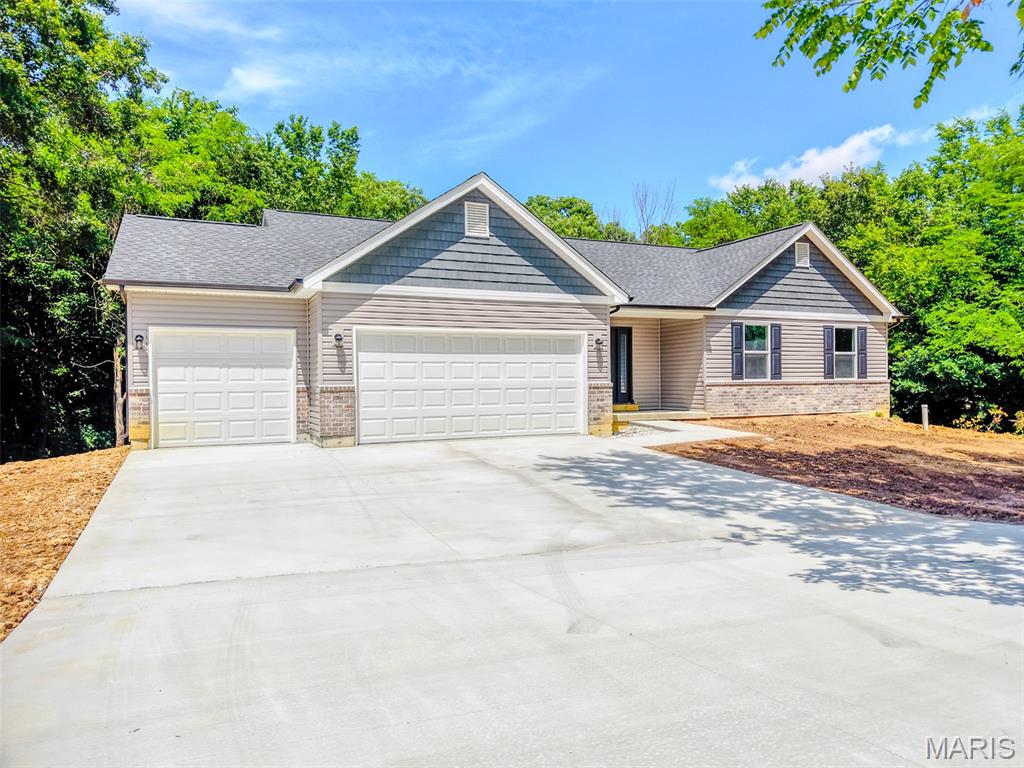 BRAND NEW! Over 1 ACRE wooded lot!!! This 1467 sq ft, 3Bed/2Bath Ranch has it all! 
Full walkout basement , 3 car finished & insulated garage w/ garage door openers. Stainless steel appliances, solid surface kitchen tops with center island, hardwood floors throughout main level, MAIN floor laundry, tile floors in both bathrooms, black fixtures, custom color walls and door slabs, open stair rail to the full WALKOUT basement!
