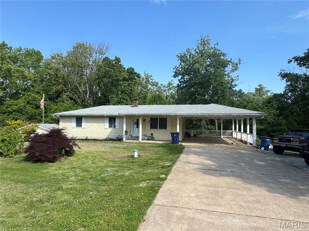 Charming 3-bedroom, 2-bath ranch located on 2 acres m/l in the desirable Washington School District! Enjoy peaceful country living with mature trees and a creek bordering the backyard.

This property offers plenty of space for vehicles, storage, and hobbies with a 19x15 detached garage with lean-to, 22x21 tuck-under garage, and a 29x20 two-car carport. Recent updates include a newly added dishwasher, garbage disposal, and fresh gravel on the driveway.

A great opportunity to enjoy privacy, space, and nature while still being conveniently located near town!
