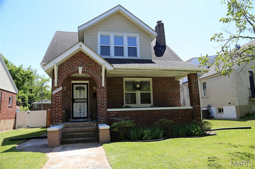 OPEN HOUSE 2-4 SUNDAY
This is one gorgeous Brick Bungalow!! Bright , Open and Airy Entry allows for all the feels!
When  you walk into the spacious living room and cozy up to the gas fireplace. A modern and updated kitchen with black and stainless appliances and even a Separate Dining Room! Vinyl windows allow for tons of natural lighting to flow thru. Upstairs enjoy a very nice master bedroom which offers double walk in closets! Two additional bedrooms and another full updated bath completes the upper level. Bathrooms been redone  Vanity Tub Tile Shower Fixtures and more! Also 1/2 bath on main level has been updated! This home has been loved and updated as owners enjoy all the amenities! Did I mention Elementary School across the Street. Also included is a very nice 2 car garage and a level fenced backyard.Bach and front are nicely landscaped  If you like outdoors you will love sitting on the front porch or enjoy being walking distance to the LOOP, MetroLink & Heman Park. Centrally located and just minutes away from Wash U, Fontbonne, downtown Clayton & the Central West End. Move in Ready!! (curtains do not stay)