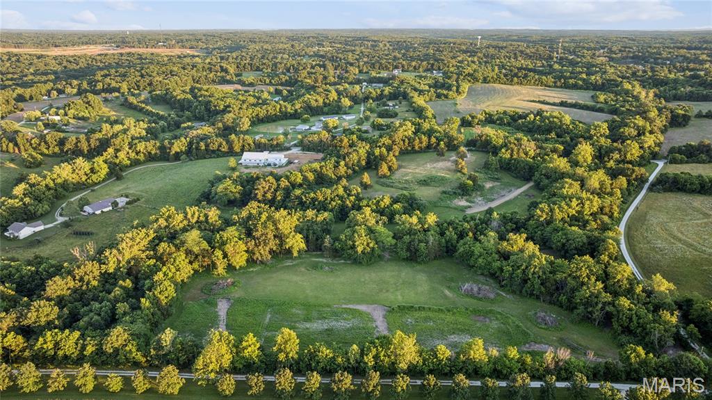 Discover your own private slice of the countryside, approximately 15 secluded acres just outside Warrenton, with a small creek winding through the heart of it.
This is land made for big plans. Build the custom home you've been dreaming of, start the hobby farm, or carve out a recreational retreat and weekend escape all your own. Surrounded by mature nature, abundant wildlife, and peaceful long views, it delivers the kind of privacy that's getting harder and harder to find.
And you get there on your terms: private road access off Lix Road keeps the world at a distance, while I-70 sits just four minutes away, so seclusion never costs you convenience or an easy commute. Local amenities are close at hand. A portion of floodplain acreage only adds to the scenic character, keeping the creek corridor green, natural, and beautiful.
Need more room to roam? This tract is also available as part of the full 22-acre offering (MLS #26038812), or scaled down to a 5–7 acre parcel (MLS #26038876). Explore all three and pick the footprint that fits your vision.
Come walk it and start imagining what's possible.