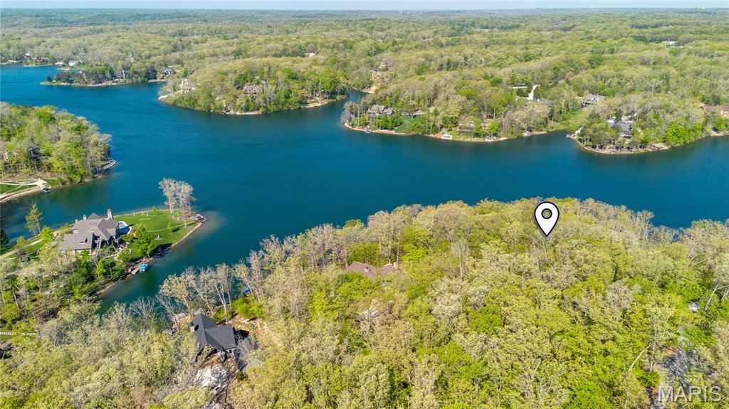 This is your chance for a rare opportunity to build on the shores of prestigious Lake Alpine, one of Innsbrook’s most coveted lakes. This beautiful 1.77-acre wooded homesite offers over 225 feet of lake frontage, incredible southwest-facing water views, and a gentle slope with ideal topography for a custom lakefront retreat. Tucked into a quiet cul-de-sac near the Konstanz gate, the setting offers both privacy and easy access in and out of the resort. Surrounded by established luxury homes while still feeling private and natural, this exceptional lot provides the space and setting to design a home that captures the lake, trees, and sunset views. A private lakefront dock may be added, creating the full Lake Alpine lifestyle for boating, swimming, relaxing, and entertaining. With no required timeline to build, the next owner can secure a premier lakefront property now and create their vision when the time is right.