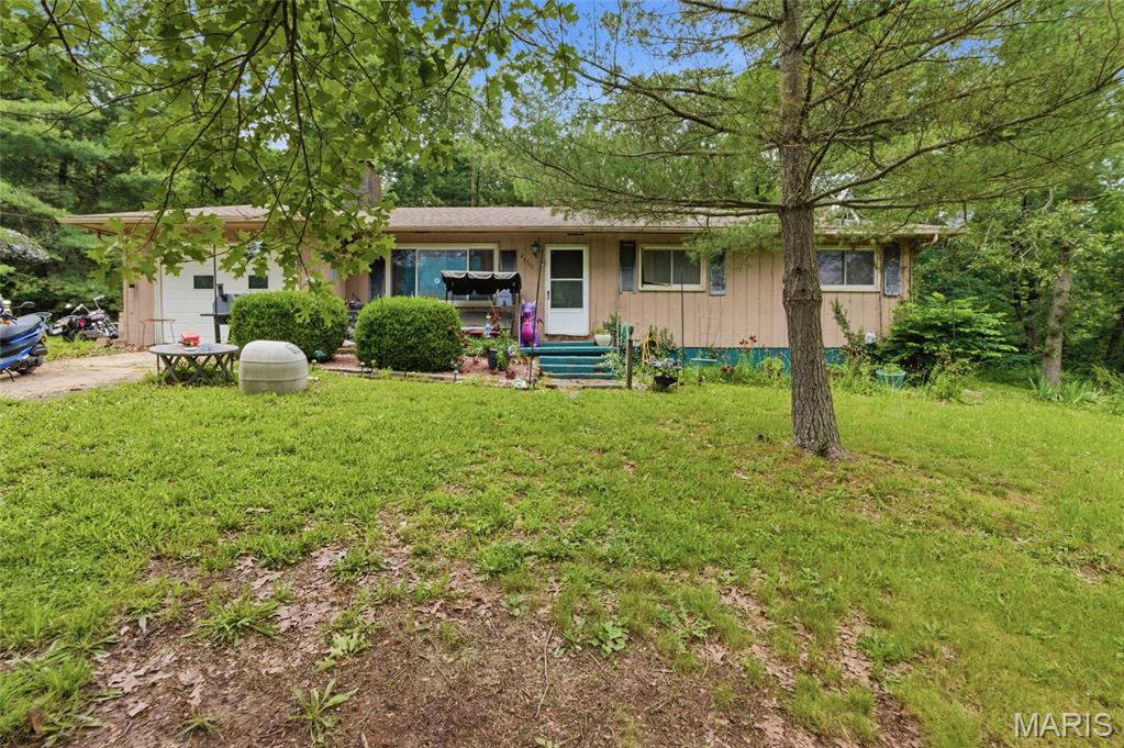 Opportunity awaits with this 3-bedroom, 1.5-bath home situated on 1.35 acres at the end of a quiet dead-end road. Tucked away from through traffic and surrounded by the peaceful feel of country living, this property offers the privacy and space that so many buyers are searching for.

Whether you're an investor looking for your next project, a flipper seeking value-add potential, or a buyer with a vision to create your dream home, this property presents endless possibilities. The spacious lot provides plenty of room to expand, garden, add outdoor living areas, or simply enjoy the open space and natural surroundings.

Inside, you'll find both a living room and a separate den, providing multiple gathering spaces and flexibility for a variety of lifestyles. Whether you envision a cozy family room, home office, game room, or entertainment area, the additional living space creates even more potential for customization. The home's layout offers a solid foundation for renovation and improvement, with four bedrooms and two bathrooms providing ample room for family living, rental income potential, or future resale value.

The secluded setting at the end of the road creates a peaceful atmosphere where you can enjoy quiet evenings, outdoor activities, and the beauty of having extra acreage to call your own.

Properties with this much potential, privacy, and land are becoming increasingly difficult to find. Being sold as-is, this is your chance to unlock the value and transform this property into something truly special.

Bring your ideas, your tools, and your imagination—schedule your private showing today and discover the possibilities waiting for you on this unique 1.35-acre property!