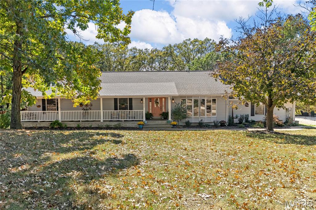 WOW LOOKING FOR THAT EQUESTRIAN PROPERTY THAT HAS IT ALL LOOK NO FURTHER! This is a one-of-a-kind EQUESTRIAN PROPERTY on private 9.79+/- acre lot in WILDWOOD w/CHARMING RANCH HOME, BARN & DRY LOT! 3,484+/- sqft, 3 bedroom, 3 full & 1 half bath home. Cozy covered front porch. Step down Living Rm features a warming floor-to-ceiling stone Wood burning FP, wood flooring, 14’ vaulted ceiling with wood beams, plantation shutters, & walk-out to deck w/spectacular views. Eat-in kitchen w/SS applis, tile counters & BS, & breakfast bar to Family Rm/Breakfast Rm that boasts wood flooring & walk-out to deck. Primary ensuite w/carpeting, large walk-in closet, plantation shutters, walk-out to deck & a bath boasting dual sink vanity, Jacuzzi, & separate shower. 2 Addtl bedrooms w/carpet, walk-in closets, & plantation shutters share hall bath. Laundry rm completes the ML. LL offers a rec room with a full bath, closet & walk-out to patio. Unfinished area. 58’ x 35’ Barn w/6 stalls, tack rm, electricity & water. Country living just mins to Wildwood, Greensfelder Park, I-44, & in AAA Rockwood School.