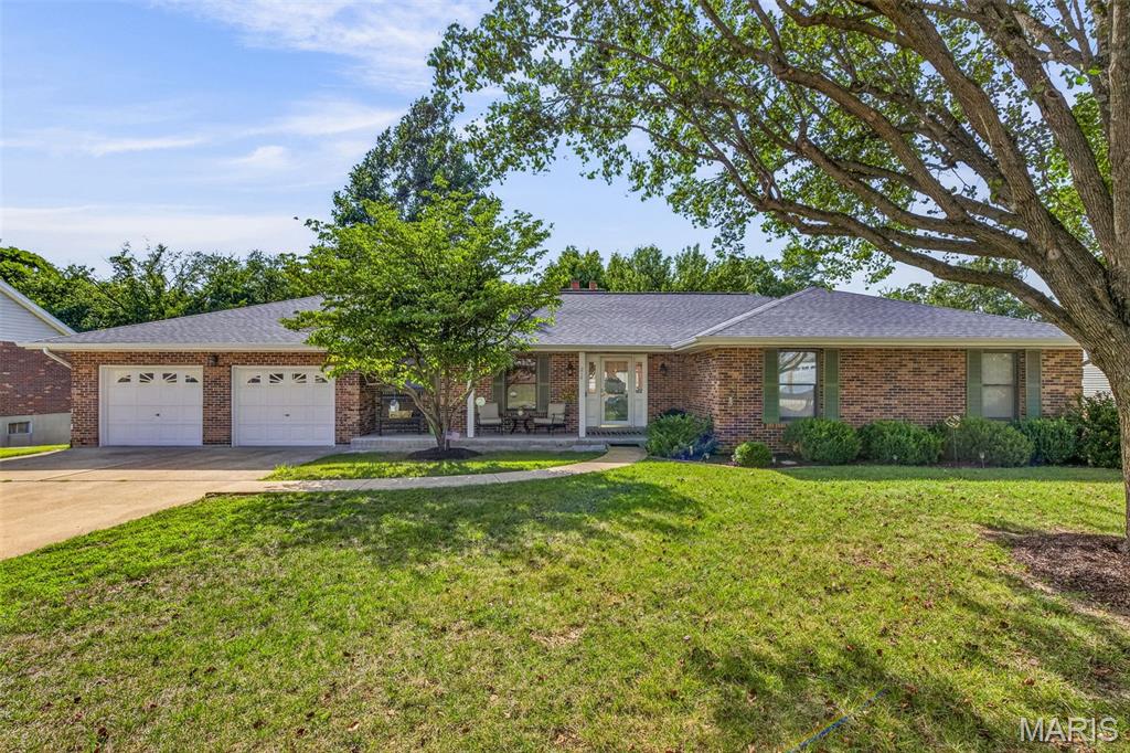 Welcome home to this beautifully maintained 1,960+ sq. ft. ranch nestled on a picturesque 1/3+ acre homesite backing to mature trees, offering the privacy and peaceful setting you've been searching for! This spacious open-concept floor plan features 2+ bedrooms on the main level, plus a versatile main-floor flex room that's perfect as a home office, guest room, playroom, or possible third sleeping area.

The stunning great room is filled with natural light and showcases soaring cathedral ceilings, a cozy gas fireplace with a brick hearth, and attractive hand-scraped hardwood laminate flooring that flows throughout much of the main level. The spacious kitchen is sure to impress with its updated custom oak archtop cabinetry, stainless steel appliances, and convenient access to the separate dining room—perfect for entertaining family and friends.

Retreat to the generous primary suite featuring his-and-her closets and an updated private bath complete with comfort-height vanities and a large walk-in shower. A convenient main-floor laundry room adds everyday functionality.

The oversized 2-car garage, measuring over 30 feet deep, is a rare find and offers exceptional space for vehicles, a bass boat, workshop, or extra storage.
The partially finished walk-out lower level expands your living space with a large family room featuring a wood-burning fireplace, a full bath, an additional possible sleeping area, exercise room, hobby/craft room, and abundant storage for all your needs.

Homes offering this combination of space, versatility, privacy, and an oversized garage are few and far between. This truly is a dream setting—don't miss your opportunity to make it yours. Put this one on your "Must See, Must Have" list before it's gone!