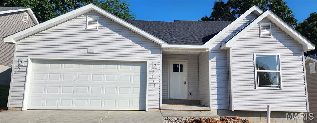 Inventory Home - Move-in Ready!  Come see this new contemporary ranch home in the highly sought-after Southern Heights subdivision! Interior pictures are a representation of colors and features. Actual colors and features may vary. Thoughtfully designed for modern living, the Tulip floor plan blends functionality with eye catching architecture and striking exterior colors that make it a true standout. Inside, enjoy soaring vaulted ceilings, stylish laminate flooring, and 5-1/4" base molding throughout. The open floorplan offers bay windows with a view of the wooded backyard, a spacious kitchen with 42" cabinets, pantry tower, center island, and contemporary lighting. Additional highlights include first-floor laundry, luxury bath, walk-out lower level, extended width driveway, and rough-in basement plumbing. Don't miss the chance to make this stunning home your own - Schedule a showing today!