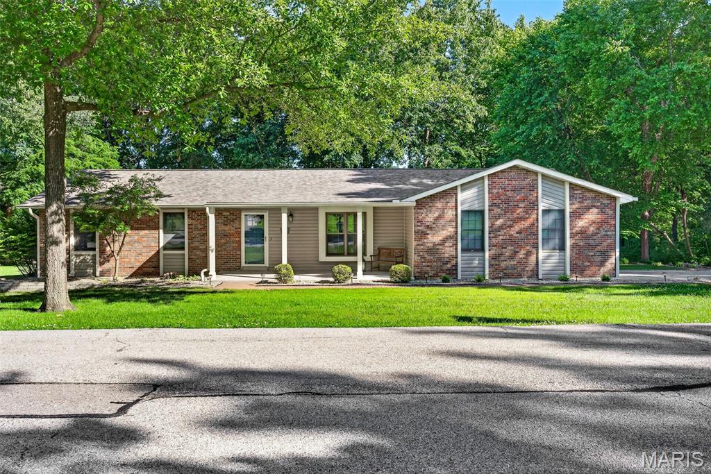 Situated on nearly an acre in desirable Weldon Spring, this 3-bedroom, 2-bath home offers space, charm, and incredible outdoor amenities. The spacious primary suite provides a private retreat, while two additional bedrooms and a second full bath offer room for family or guests. Inside, you’ll find a large family room centered around a cozy wood-burning stove, creating the perfect gathering space year-round, along with a separate dining room ideal for entertaining or everyday living. The spacious kitchen features abundant countertop space, plenty of cabinetry, and a pantry, making meal prep and storage a breeze. Step outside to your own backyard oasis featuring an inground pool and screened-in porch — perfect for relaxing summer evenings. Car enthusiasts and hobbyists will appreciate the attached 2-car garage plus an additional detached 2-car garage, offering exceptional storage and workspace options. With nearly an acre of land, hard-to-find additional garage space, and sought-after outdoor features, this Weldon Spring property combines privacy, comfort, and convenience in one beautiful setting.  Showings to start June 5, 2026.